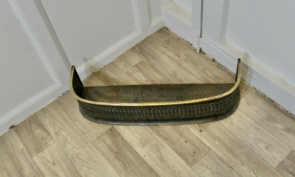 A Petite Victorian Pierced Brass And Iron Fender photo for sale