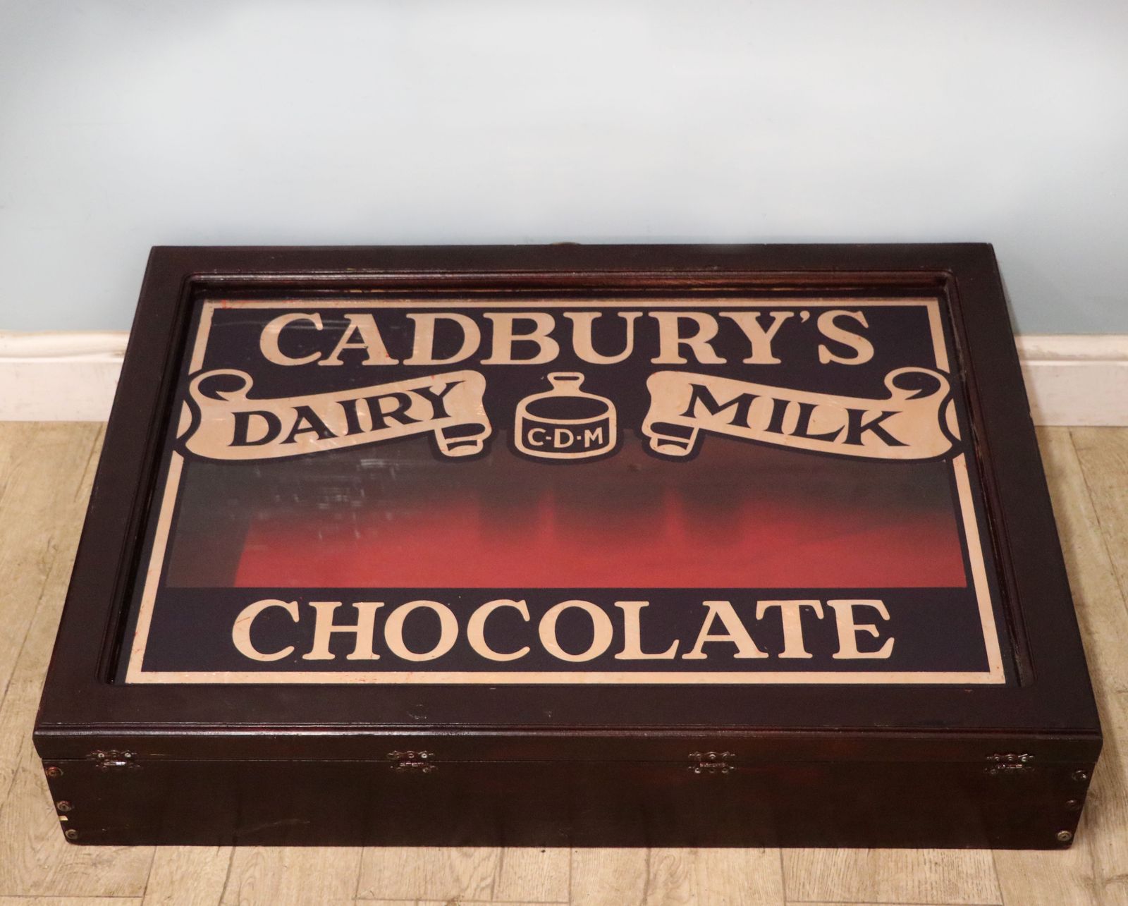 A Superb Wedge Shaped Countertop Display Cabinet, Later Hand Sign Written For Cadburys Dairy Milk Chocolate.