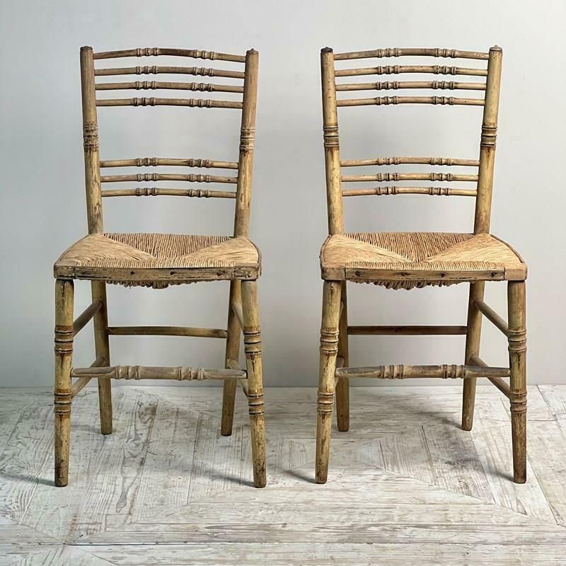 A Pair Of Painted Regency Faux Bamboo And Rush Seat Chairs photo Furniture