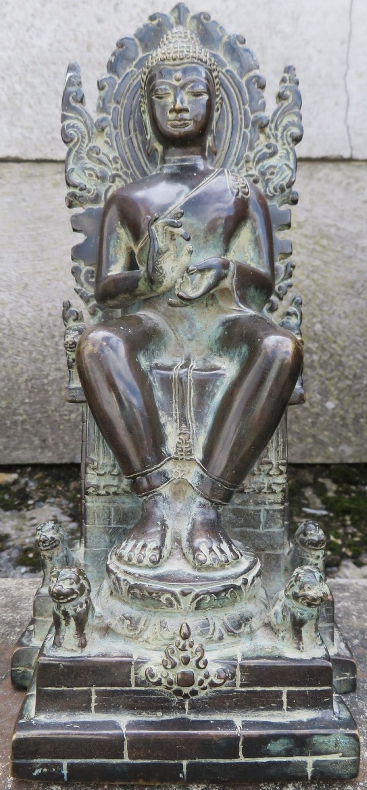 A Copper Alloy Seated Figure Of Buddha In The European Fashion. Indonesian Archipelago,Central Java. Circa Early 15th Century..