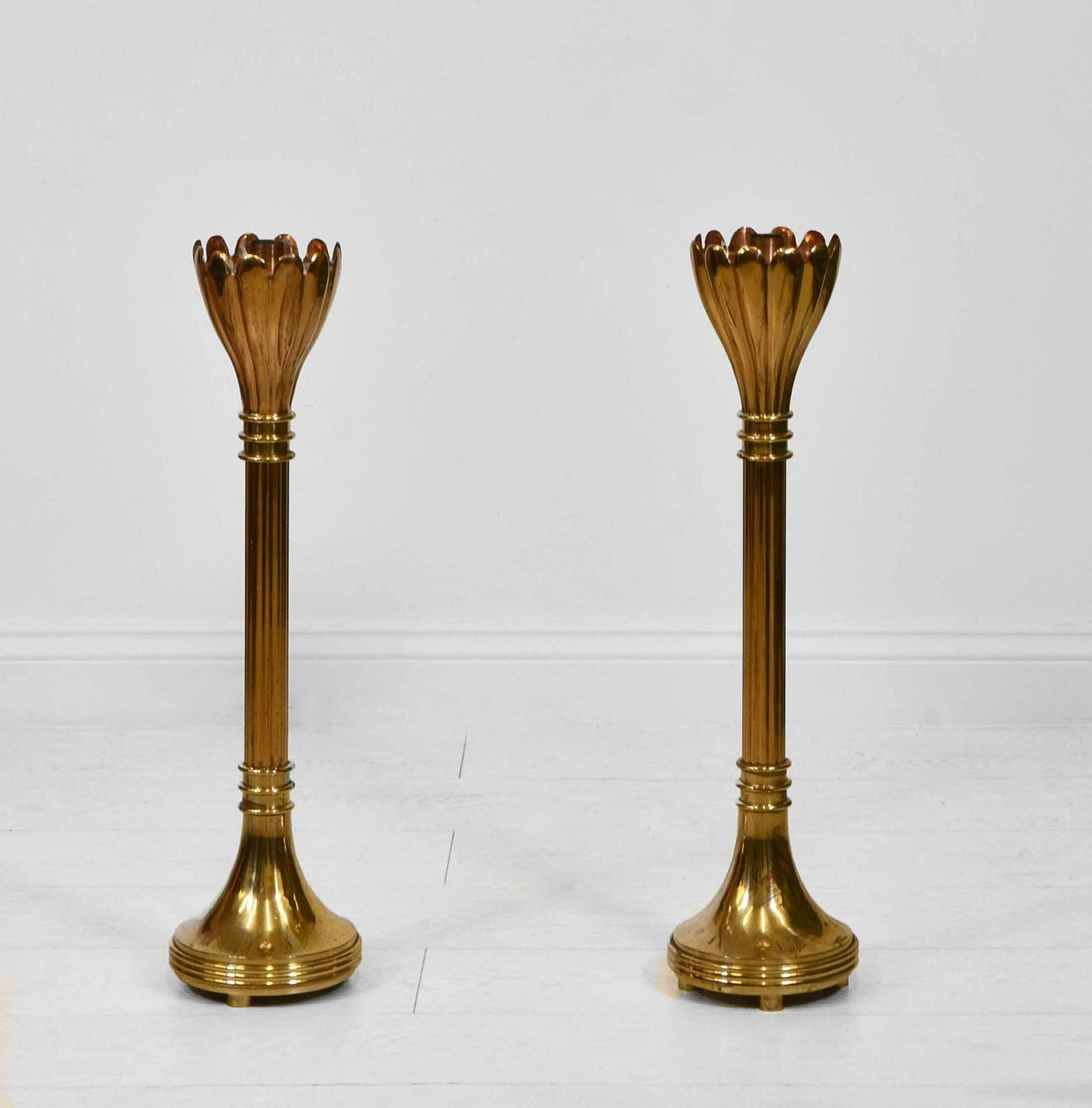 Pair Of Brass Floor Standing Candle Stands With Flared Scalloped Uppers B photo for sale