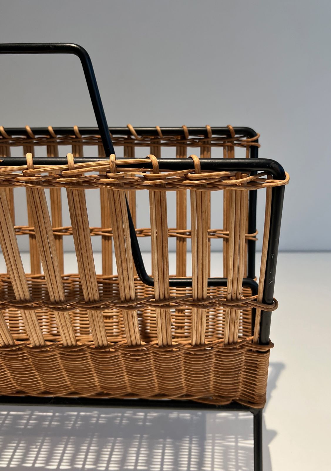 photo furniture Black Lacquered Metal And Rattan Magazine Rack