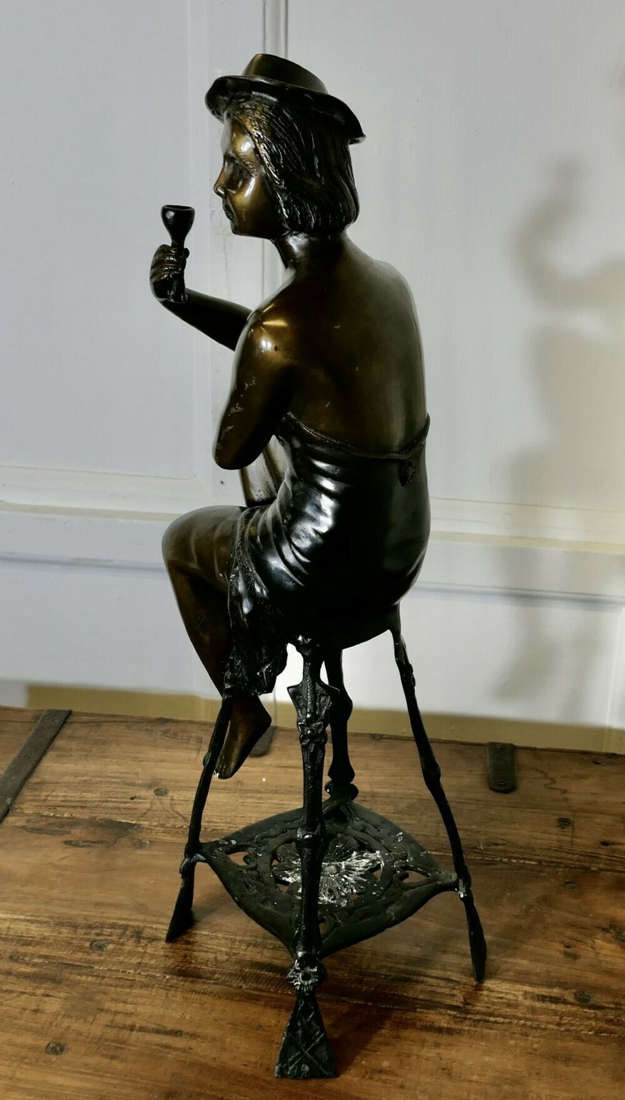 Bronze Statue Of A Girl On A Stool Drinking Champaign photo furniture
