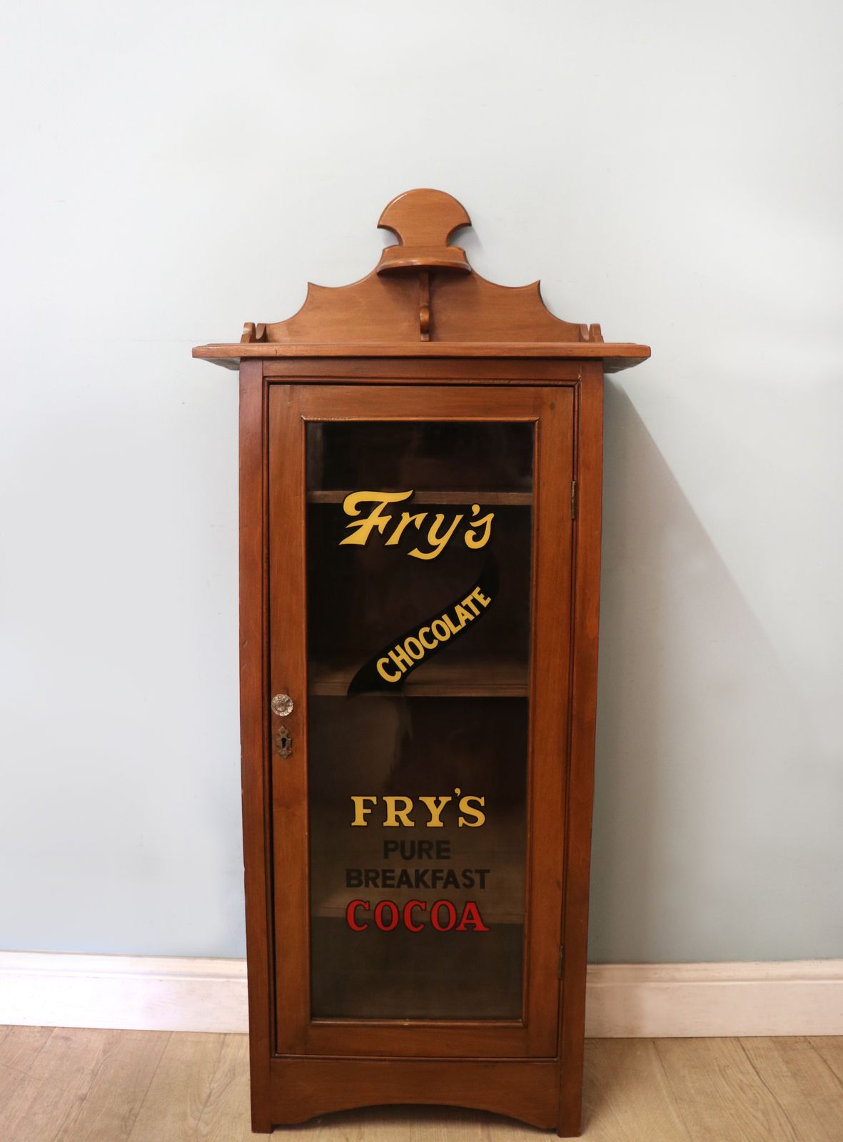 A Wonderful Victorian American Walnut Glazed Cabinet, Later Hand Sign Written Advertising For Fry's Chocolate.