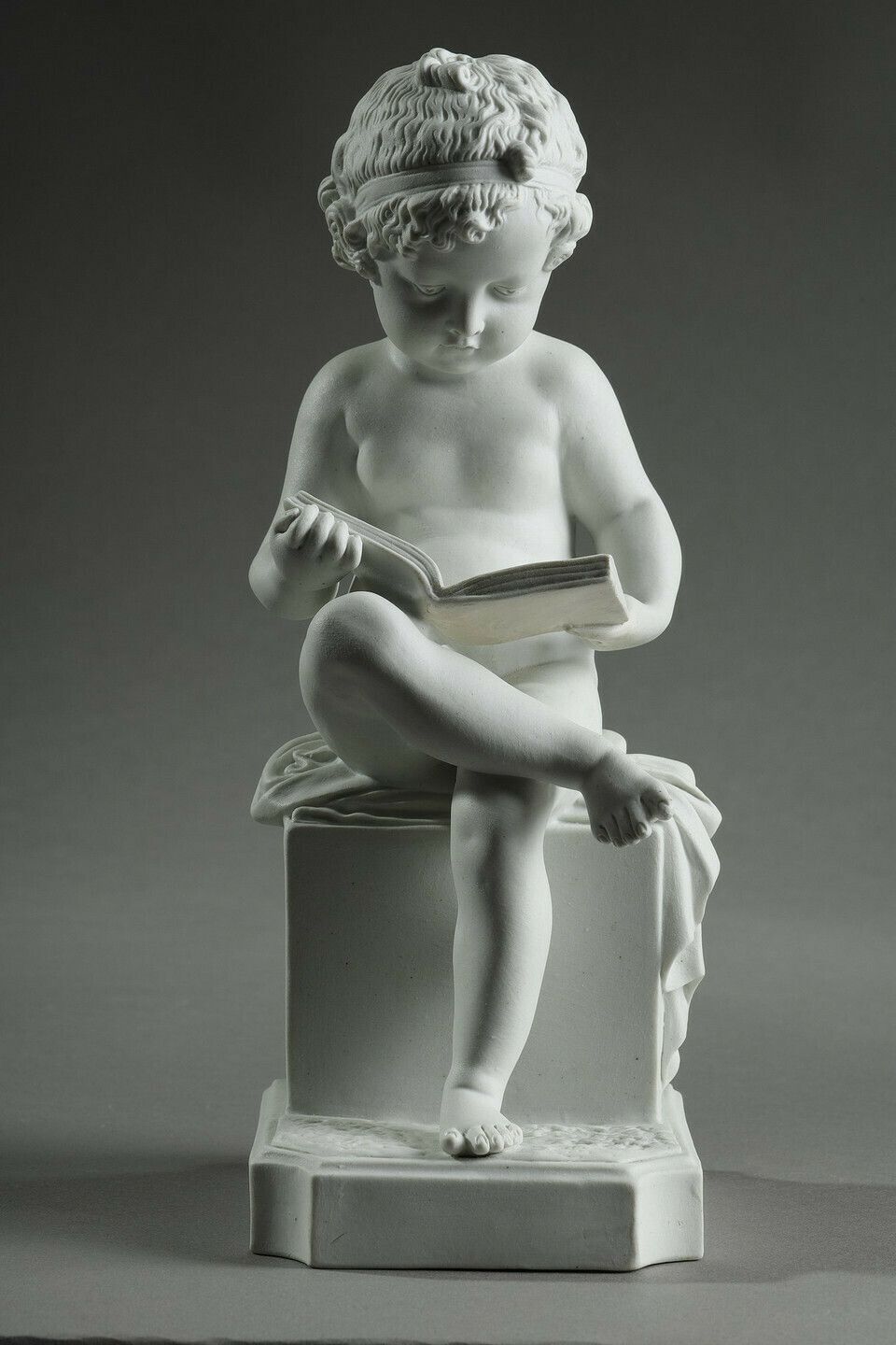 photo buy Two Subjects At Biscuit Representing The Child Reading And The Child Drawing.