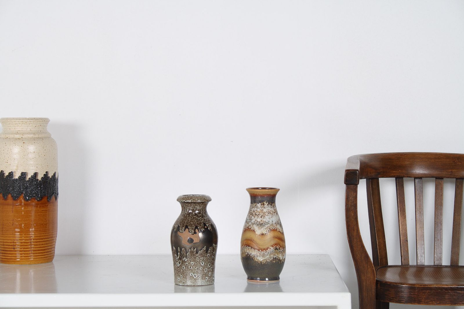 A Pair Of West German Pottery Lava Vases In Earthy Vibrant Tones photo vinterior