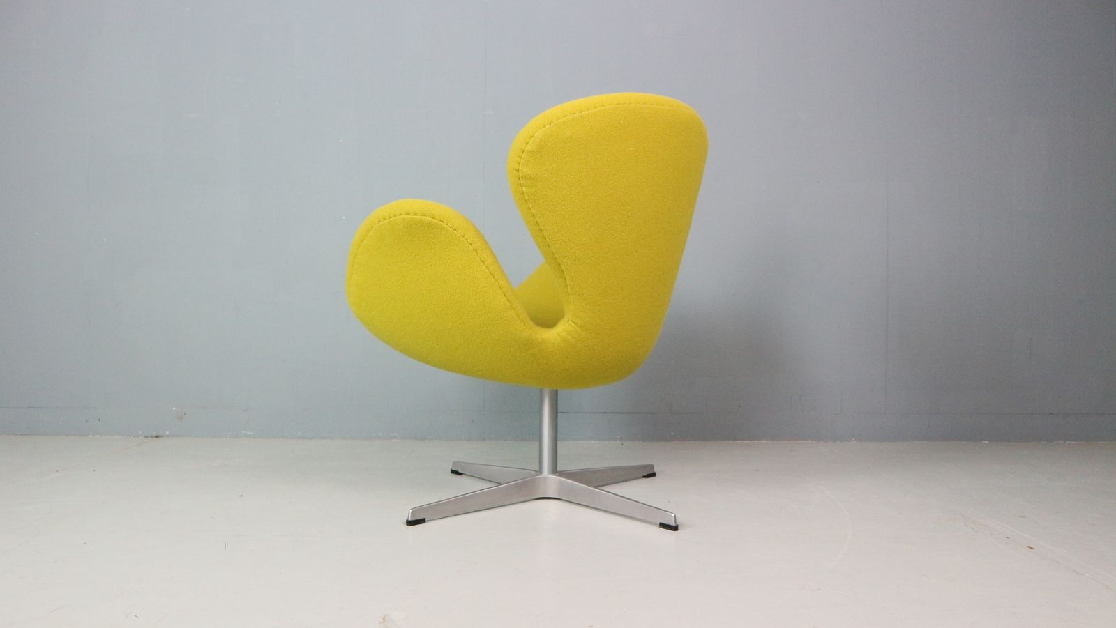 Furniture Swan Chair In Yellow Designed By Arne Jacobsen And Fritz Hansen photo