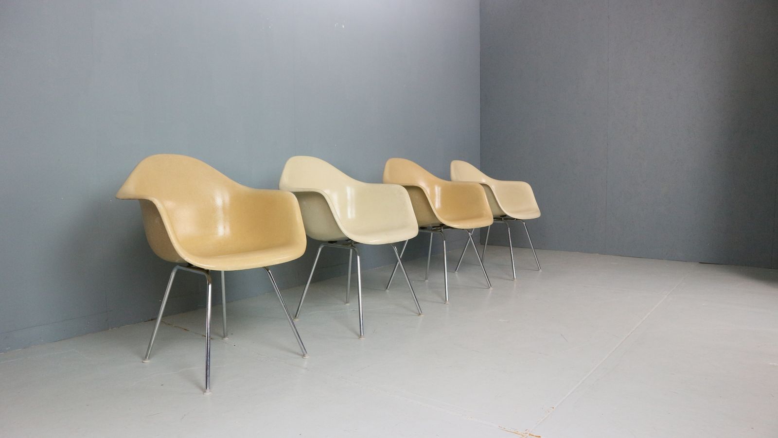 photo furniture Charles & Ray Eames Set Of 4 Off White "H Base" Chairs For Herman Miller, 1960