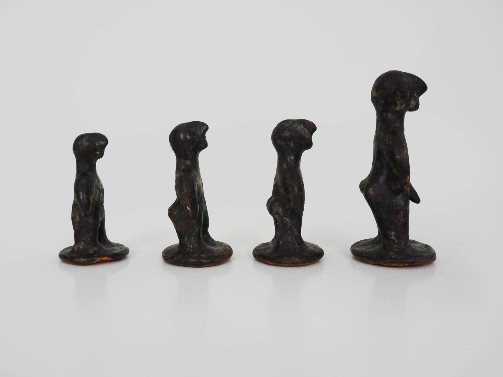 Set Of 4 Brutalist African Style Terracotta Sculptures. 60s photo for sale
