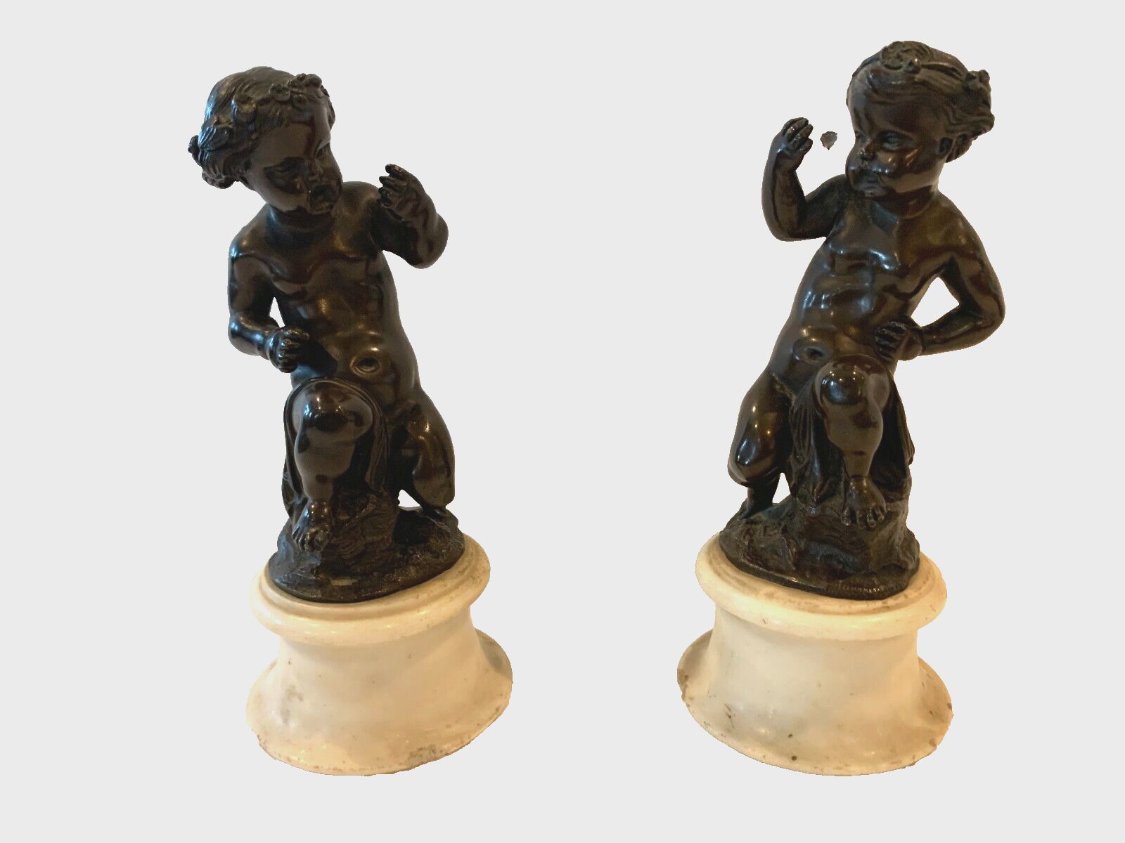 photo for sale Pair Of Bronze Putti With Brown Patina On White Marble Base 20th Century