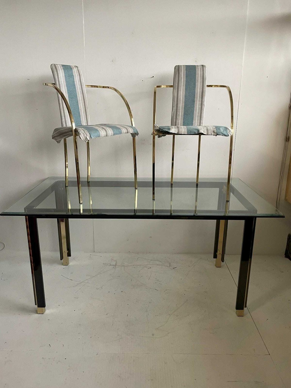 Sweeping Curved Arms That Meet At The Back And Form The Support And Legs. photo furniture