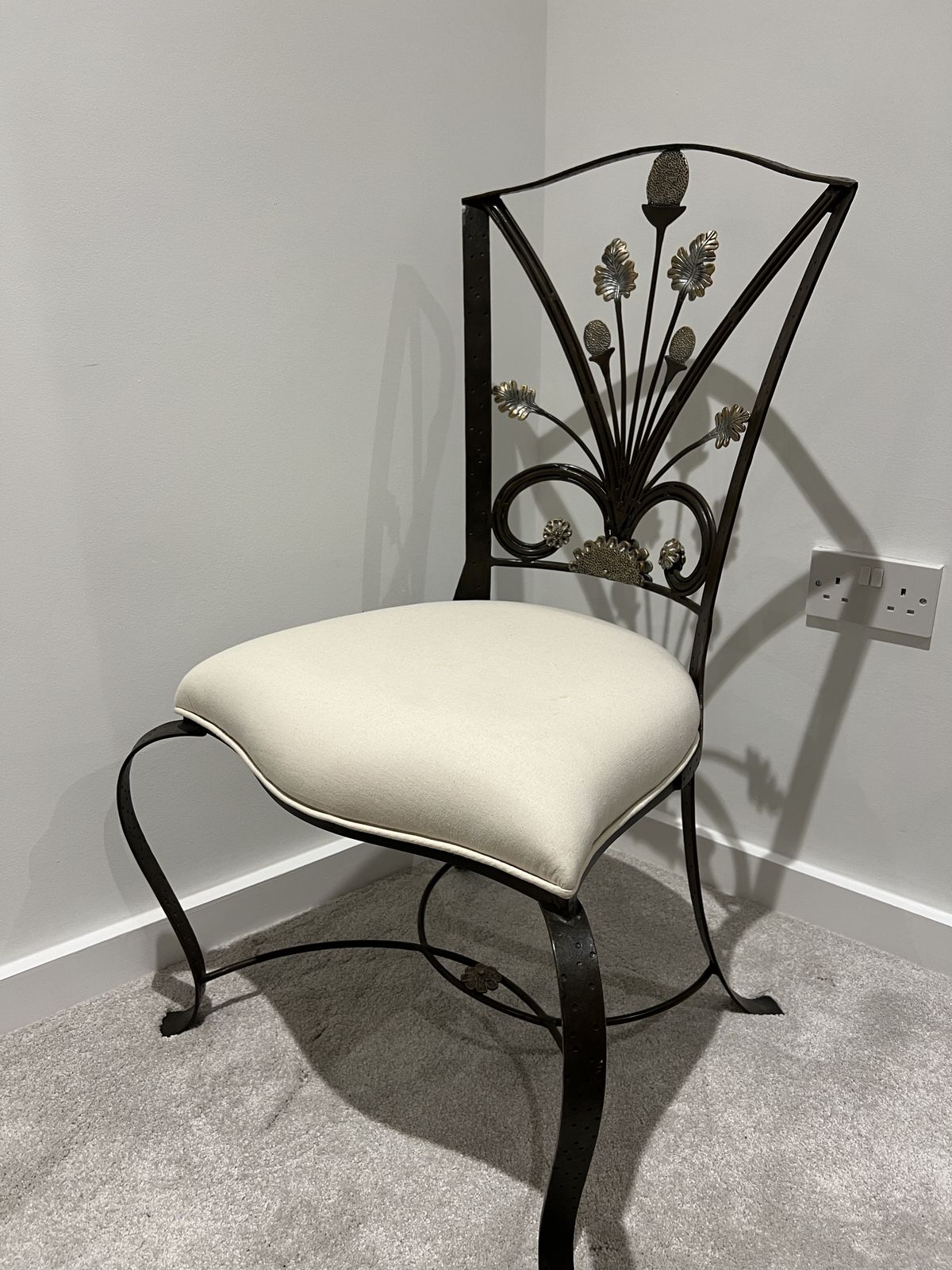 Elegant Black Wrought Iron Chair With Floral Backrest Design photo furniture