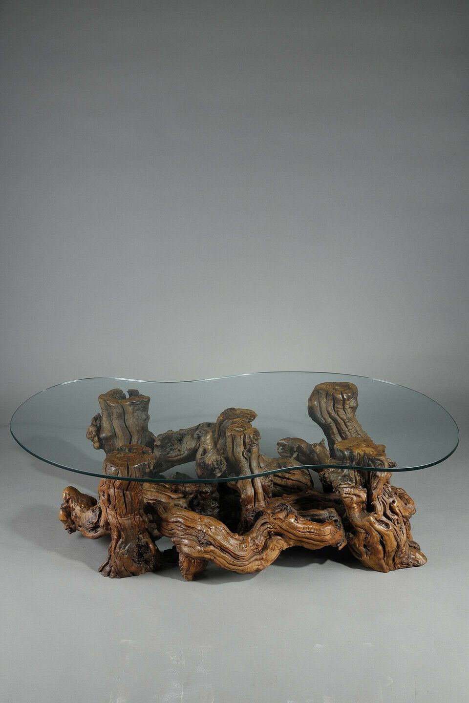 Coffee Table Made Of Tree Roots With Bean Shaped Glass Top photo furniture