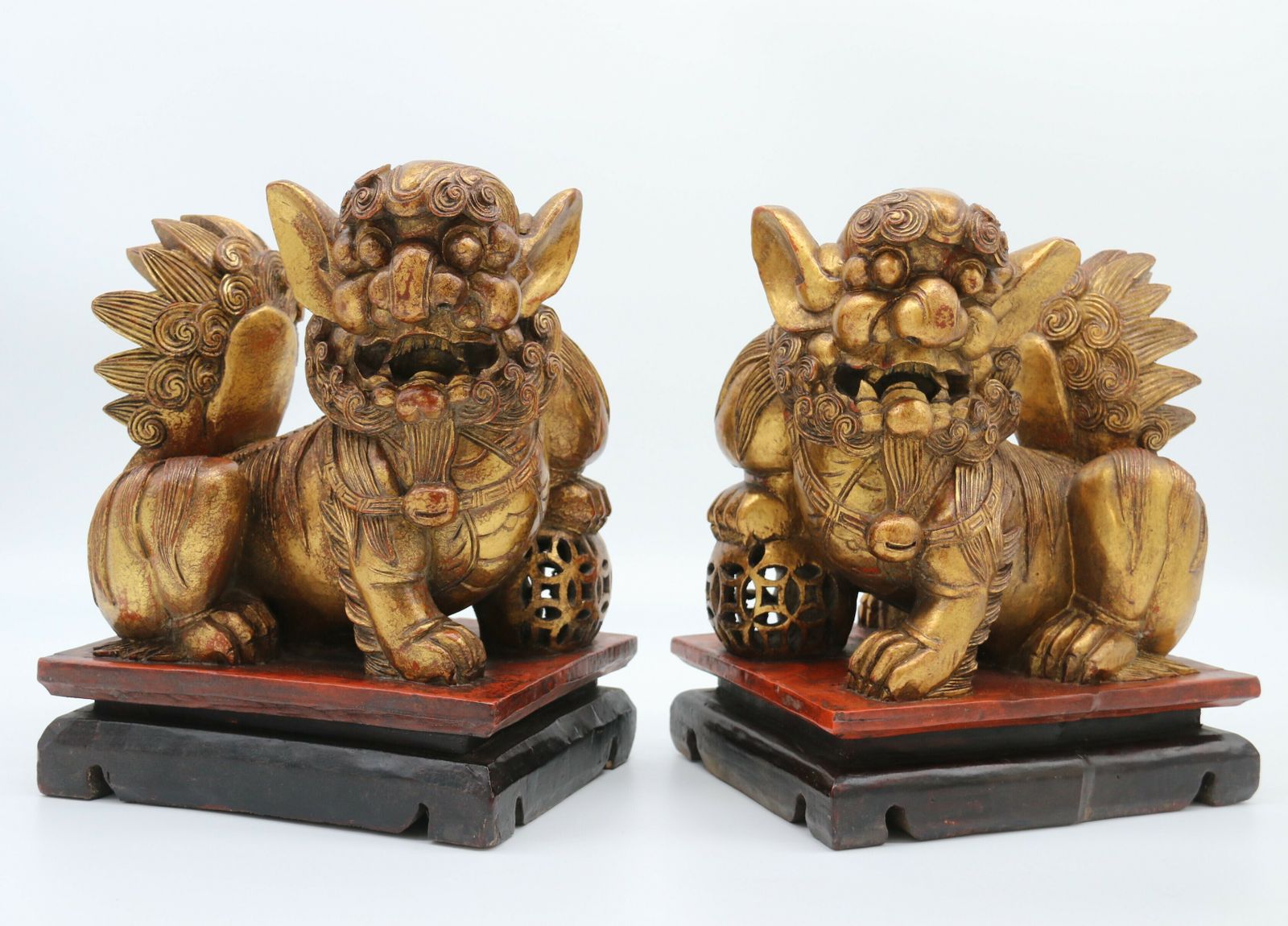 A Highly Decorative Pair Of Carved Gilt Wood And Lacquer Chinese Buddhist Lions Circa 1900