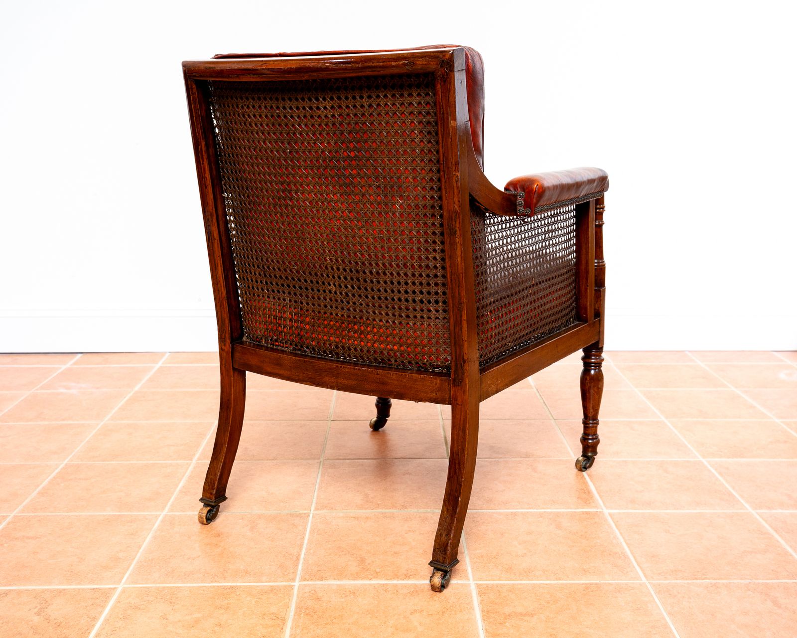 Furniture Fine Regency Bergere Leather Library Chair 1810 1820 Georgian Reading Red Leather Armchair Carved Cane Rattan Brass Castors photo