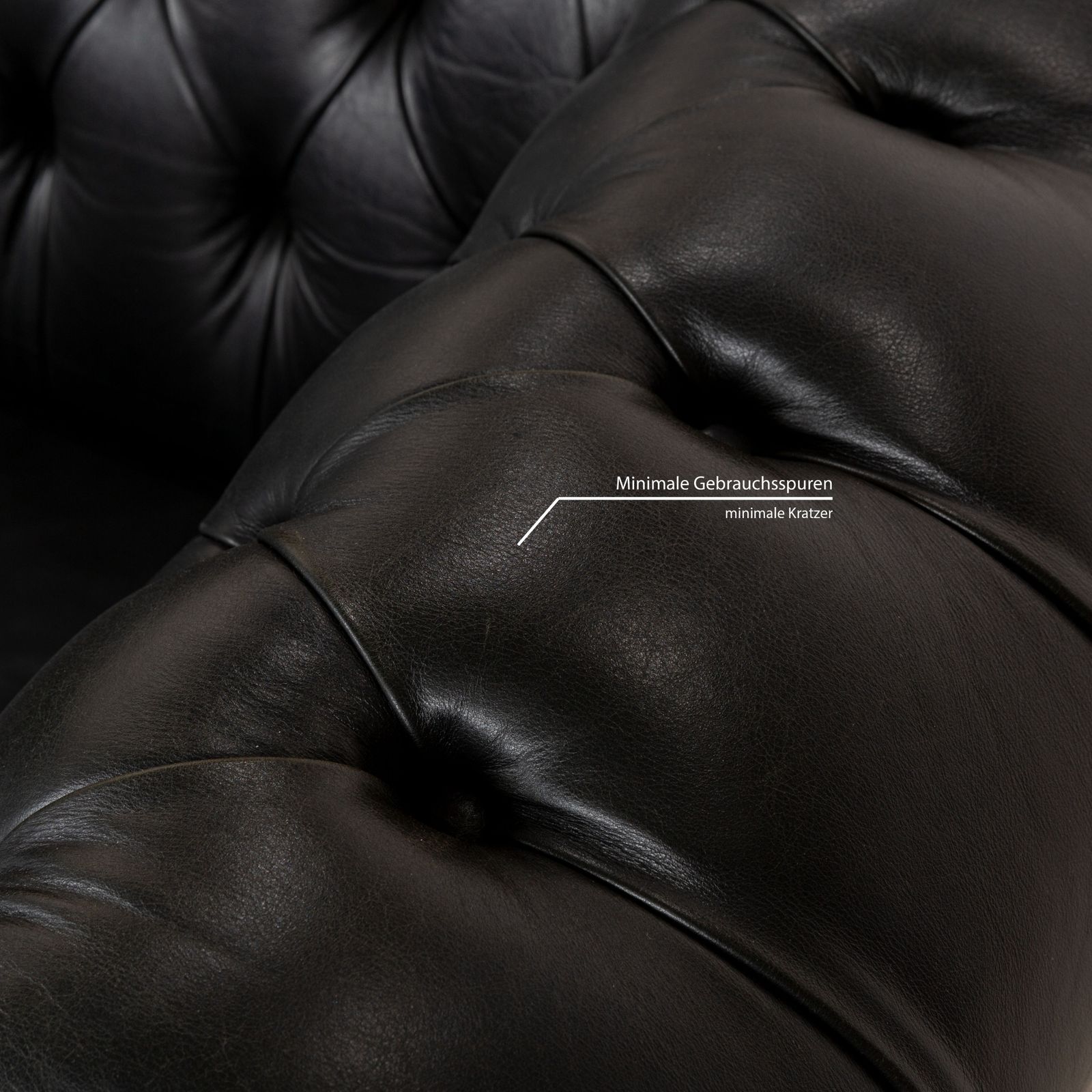 Canapé Chesterfield 2 places Natuzzi en cuir noir photo vinterior
