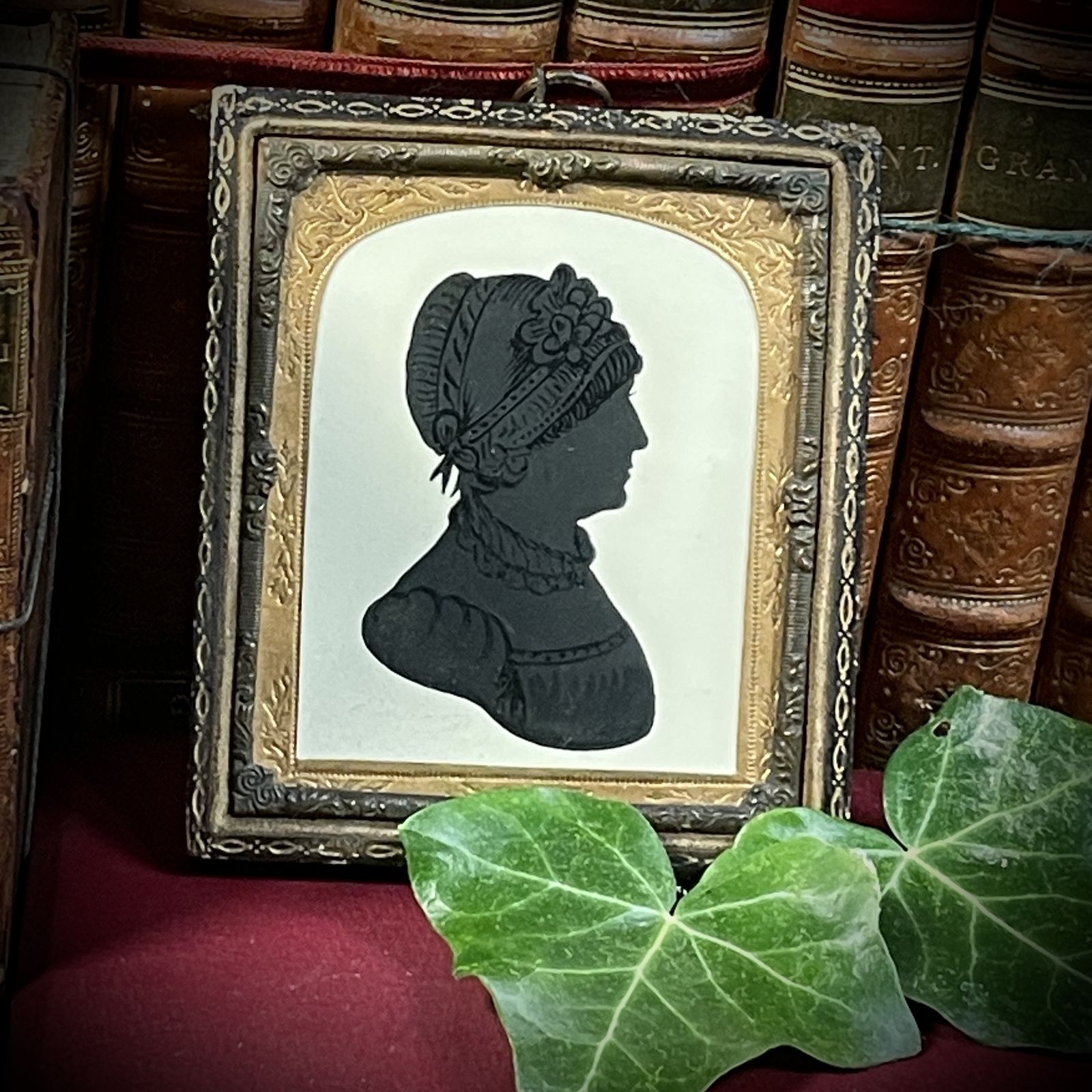 A Small Silhouette Of A Lady In A Bonnet