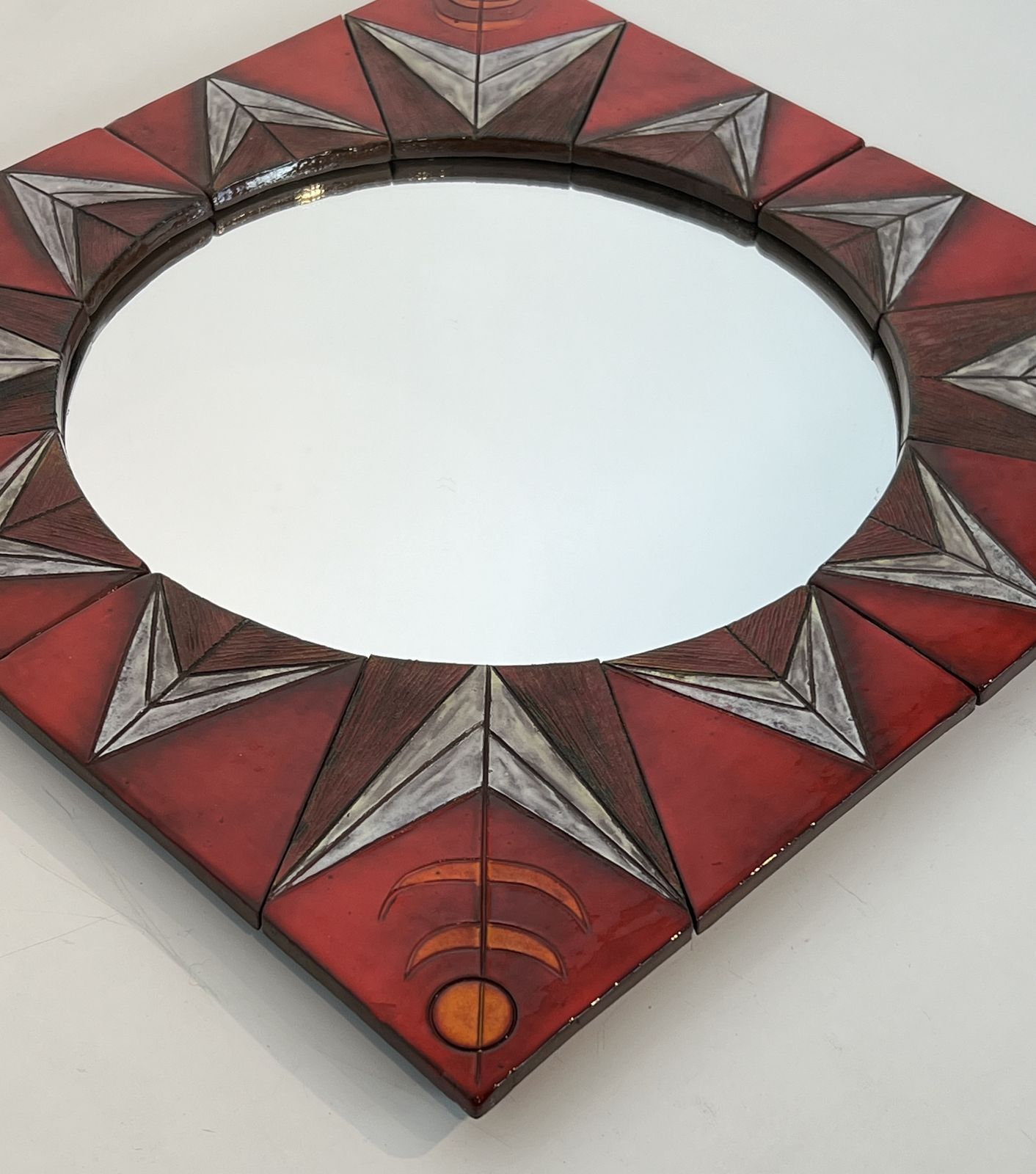 Ceramic Mirror Depicting A Stylized Sun On A Red Background Attributed To Oswald Tiberghien photo for sale