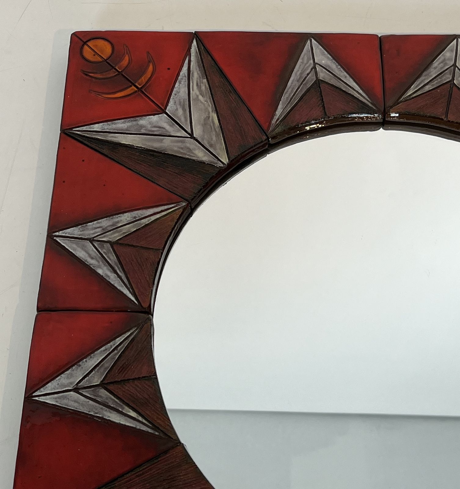 photo vinterior Ceramic Mirror Depicting A Stylized Sun On A Red Background Attributed To Oswald Tiberghien
