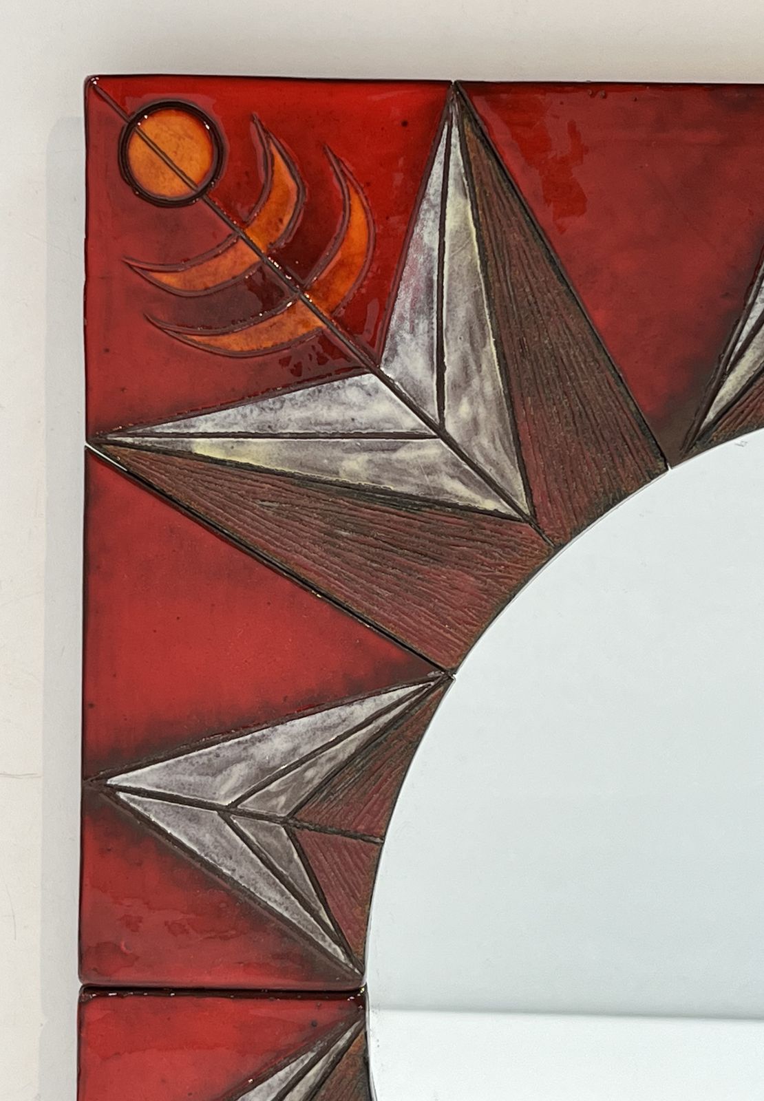 photo buy Ceramic Mirror Depicting A Stylized Sun On A Red Background Attributed To Oswald Tiberghien