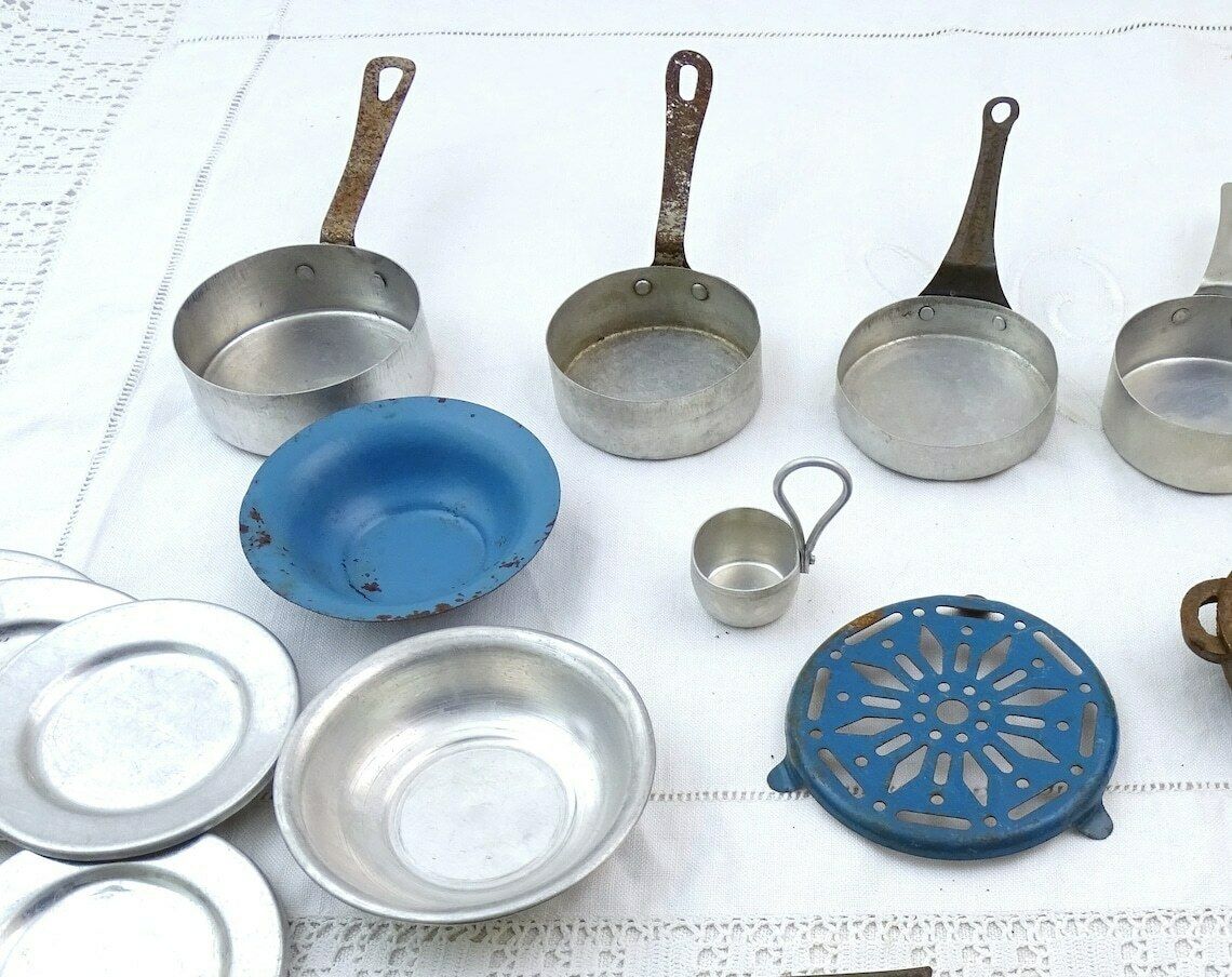 Vintage French Dolls Play Dinner Set With Enamel Trivet, Cutlery And Cast Iron Cooking Pot, Retro Childs Pretend Kitchen Toys, Kids Playing photo for sale