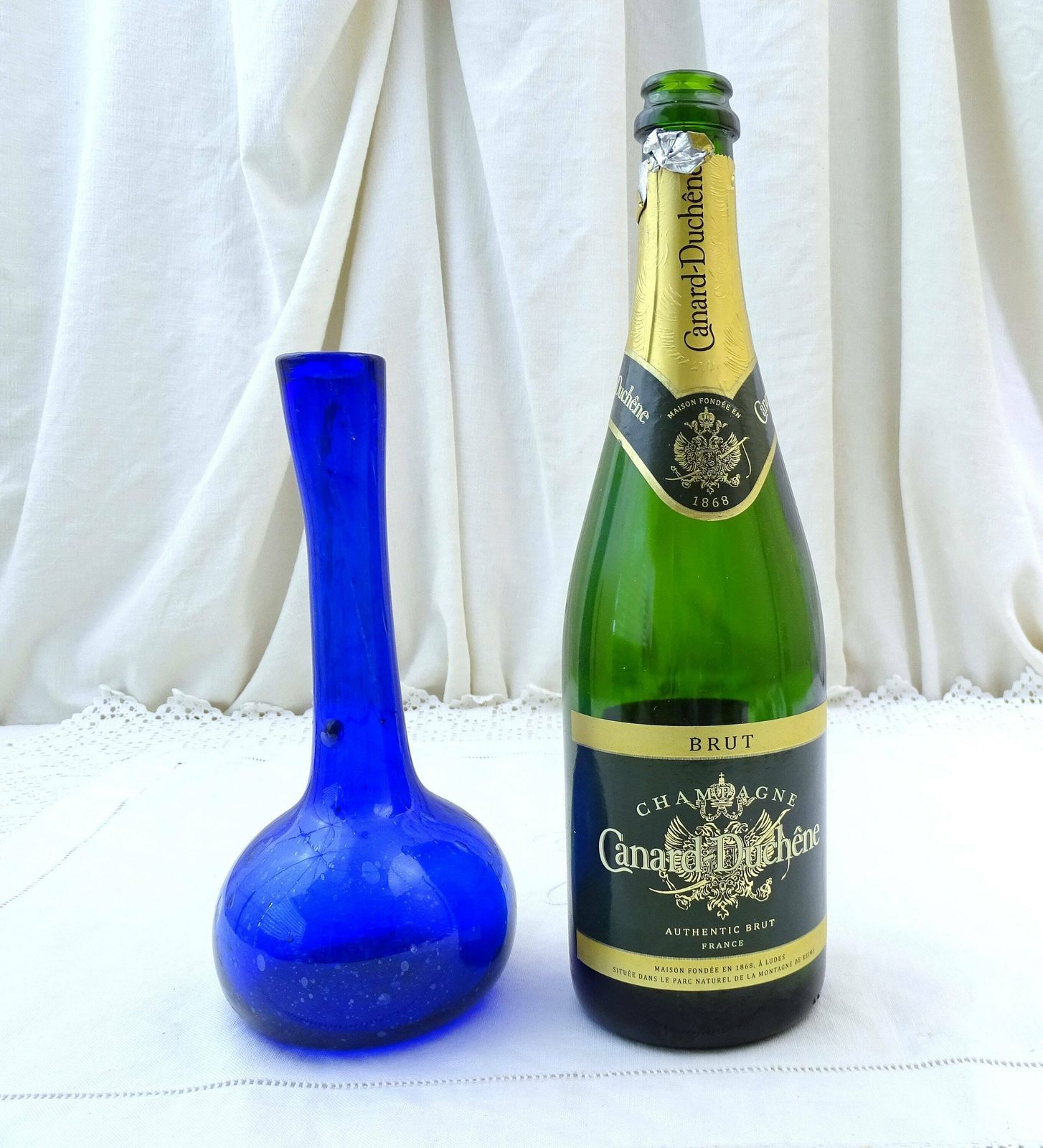 Vintage French Bottle Blue Blown Glass Tall Necked Vase With Random Air Bubbles, Retro Artisan Posy Vase From France, Old Flower Arranging photo vintage