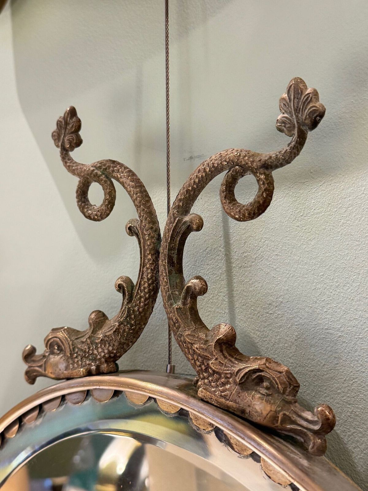 A Pair Of Italian 1940s Oval Mirrors With Dolphin Detailing Around The Brass Frame photo 3250.0