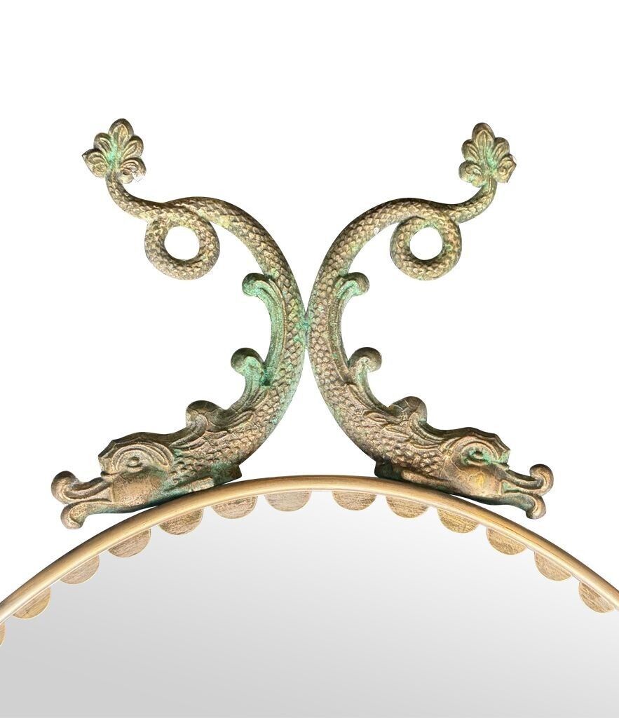 photo vintage A Pair Of Italian 1940s Oval Mirrors With Dolphin Detailing Around The Brass Frame