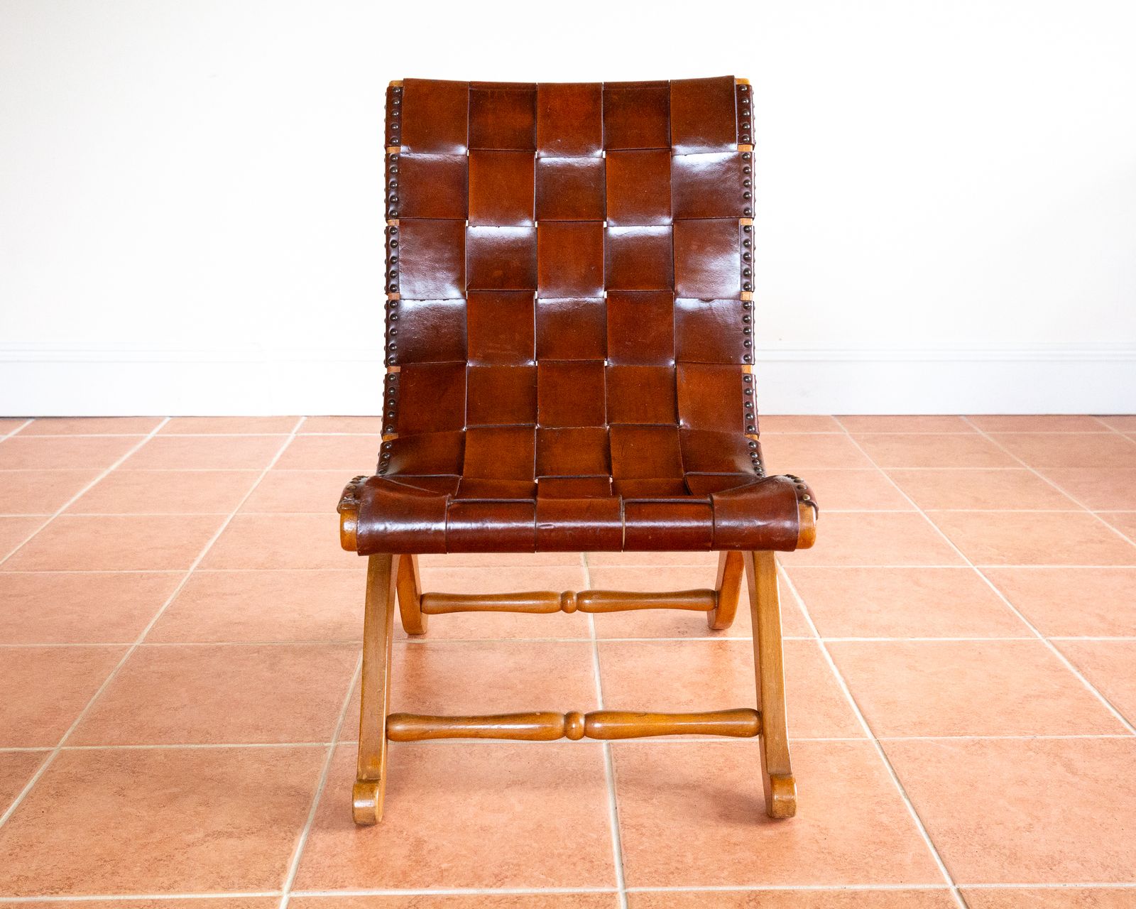 photo furniture Pierre Lottier Slipper Lounge Chair Cigar Leather Strap 1960s Blonde Valenti Spanish French Mid Century Mcm Designer Neoclassical