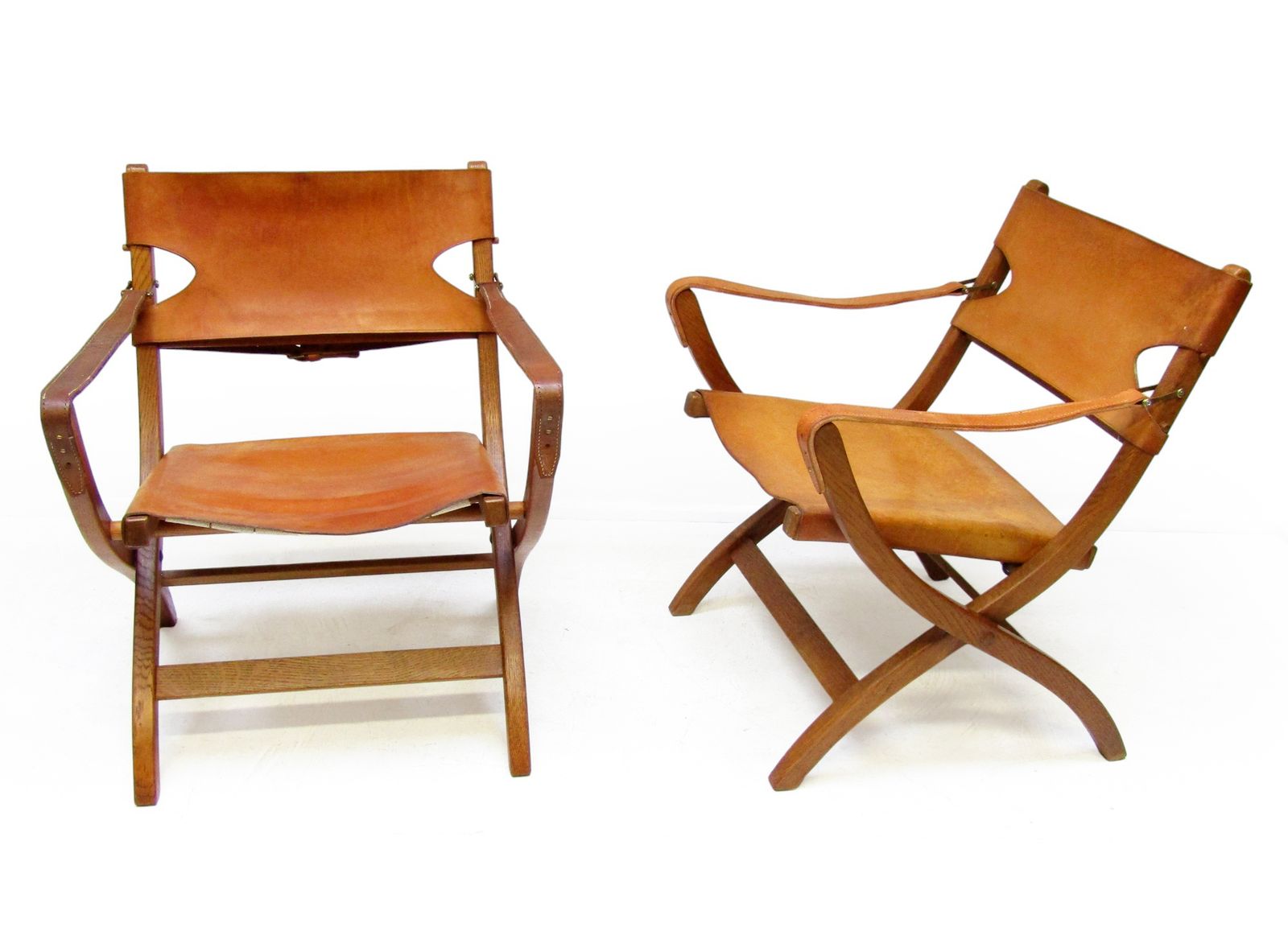 photo for sale Two 1950s Danish Safari Chairs In Oak & Hide Leather By Poul Hundevad