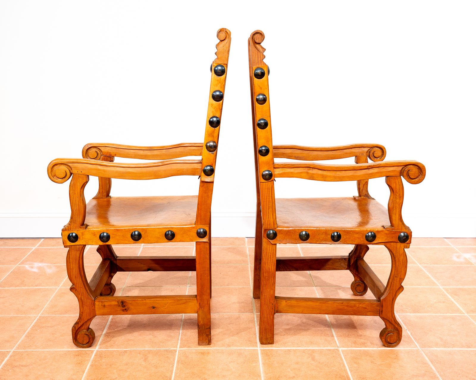 1750.0 Pair Of Large Tan Leather Throne Chairs Spanish Colonial Baroque Style Mexican Studded Vintage Pine Hall Marriage Wedding Carver Dining Armchairs photo