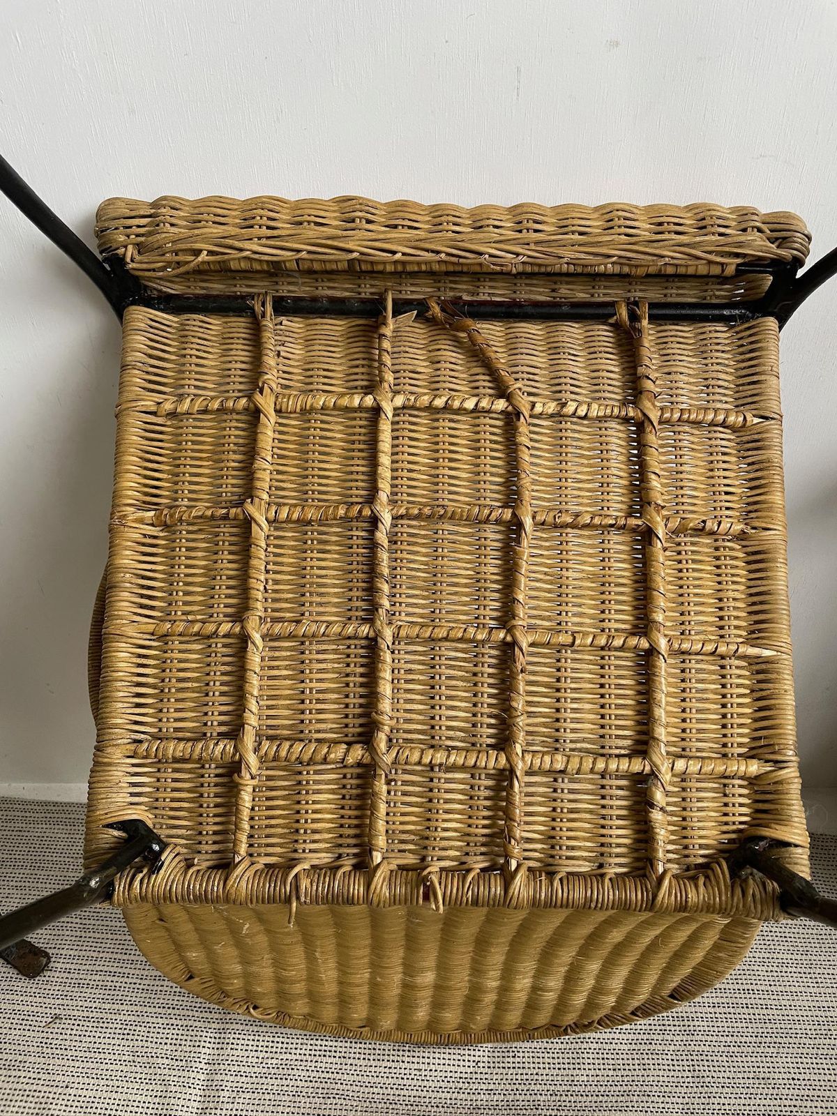 photo furniture Vintage Iron Frame Carver Chair With Woven Rattan Cane Upholstery And Curved Legs