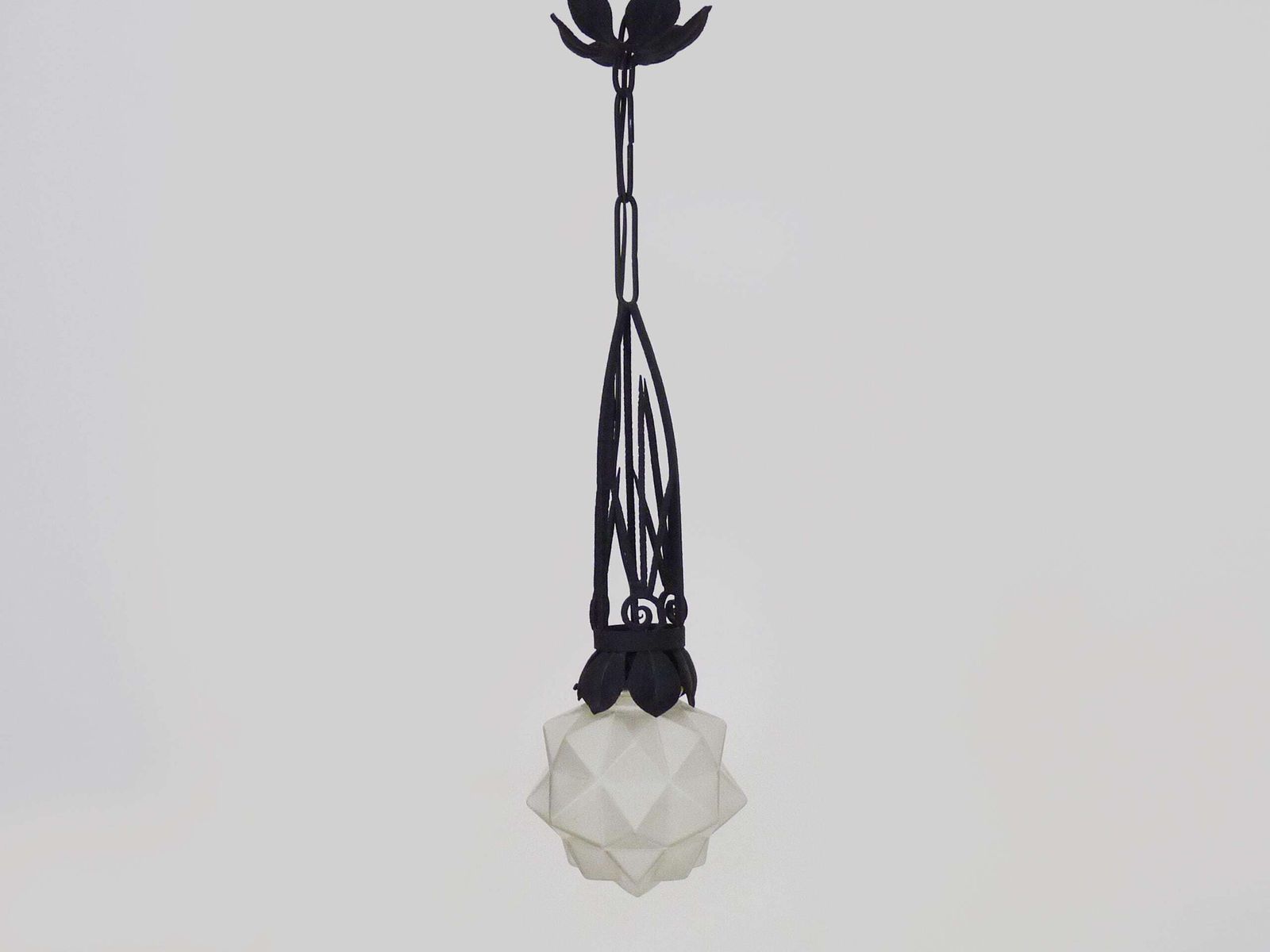 Chandelier, Art Deco Pendant Light In Wrought Iron And Star Globe In Glass Paste. 1930s
