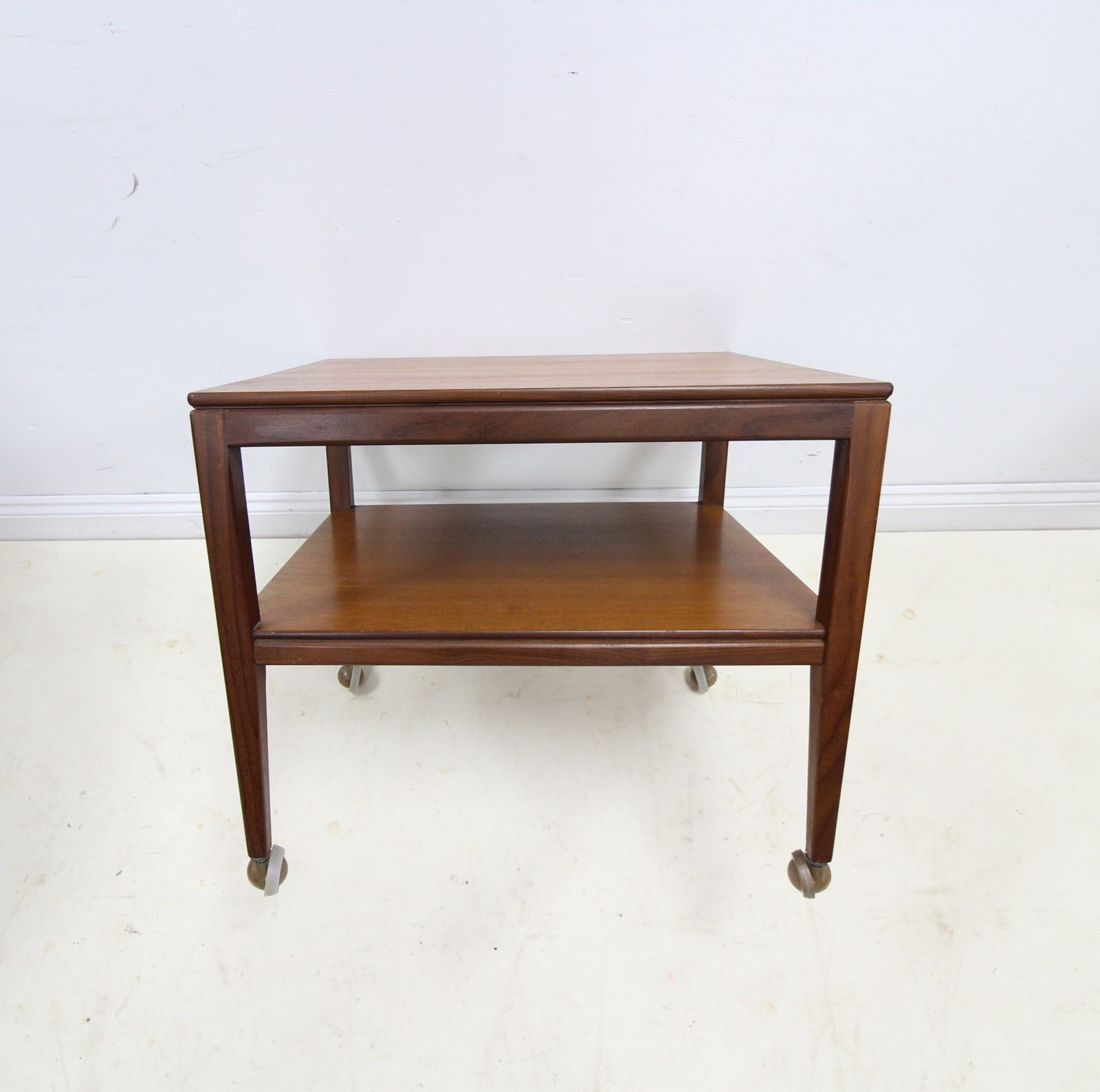 Mid Century Danish Style 2 Tier Teak Side Table On Castors photo vinterior