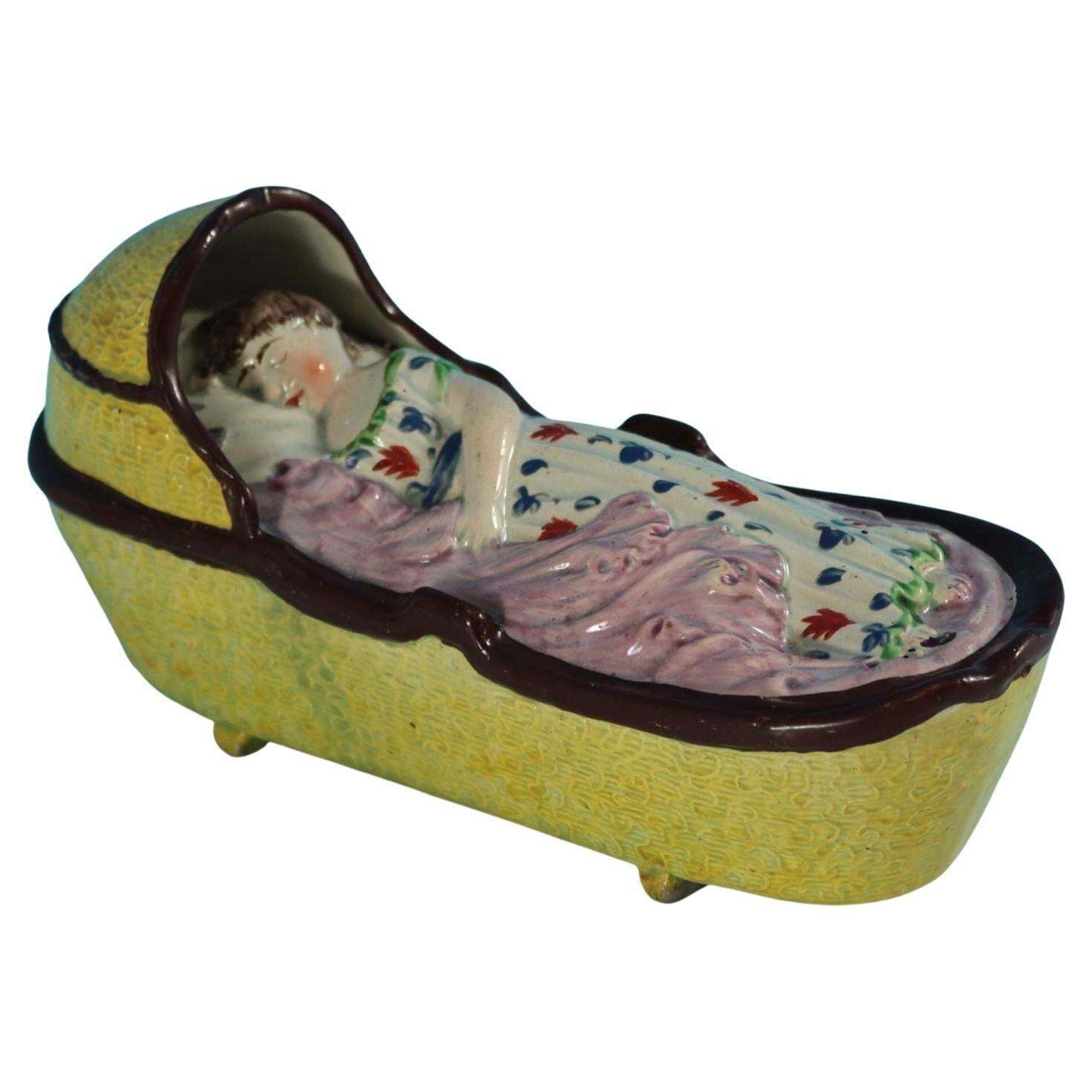 Staffordshire Pearlware Child In Rocking Cradle