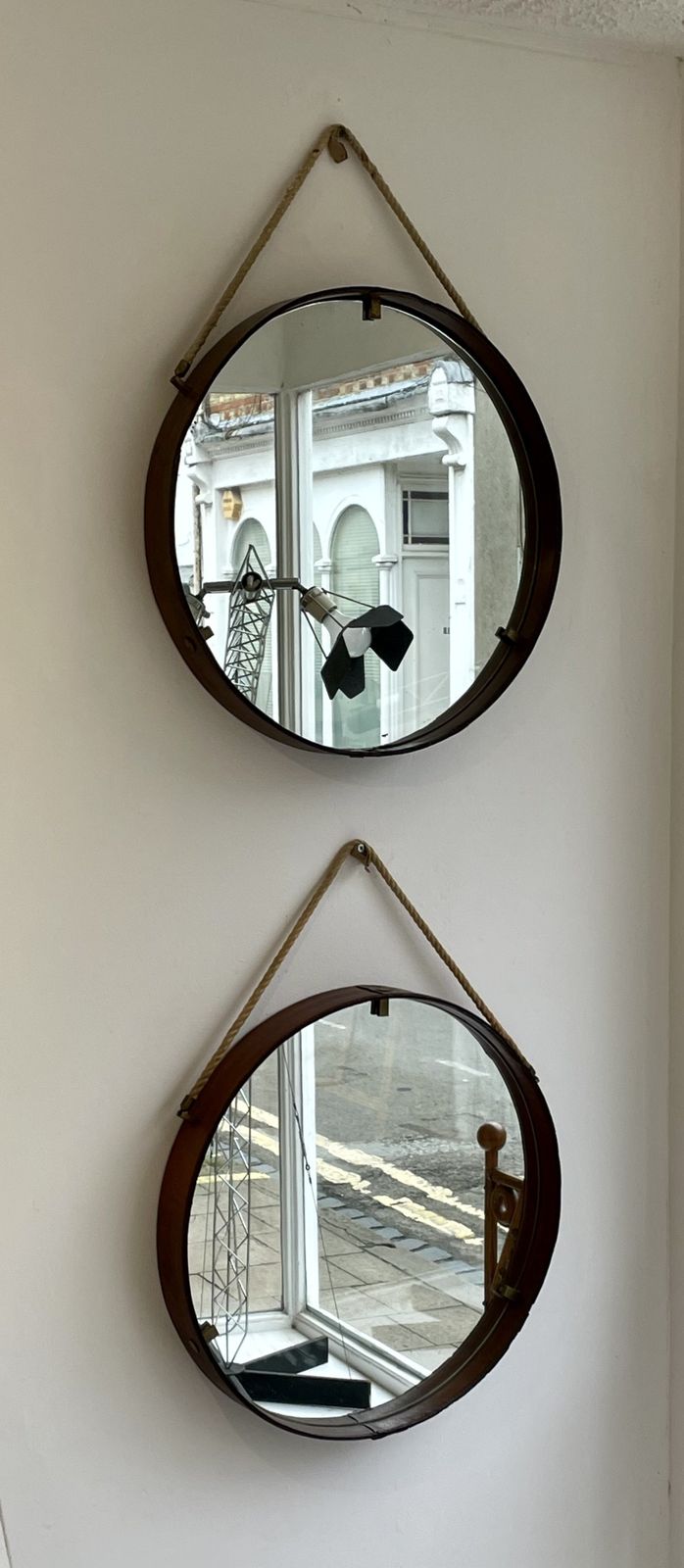 A Pair Of Circular Cognac Coloured Leather 1950s Italian Mirrors photo for sale