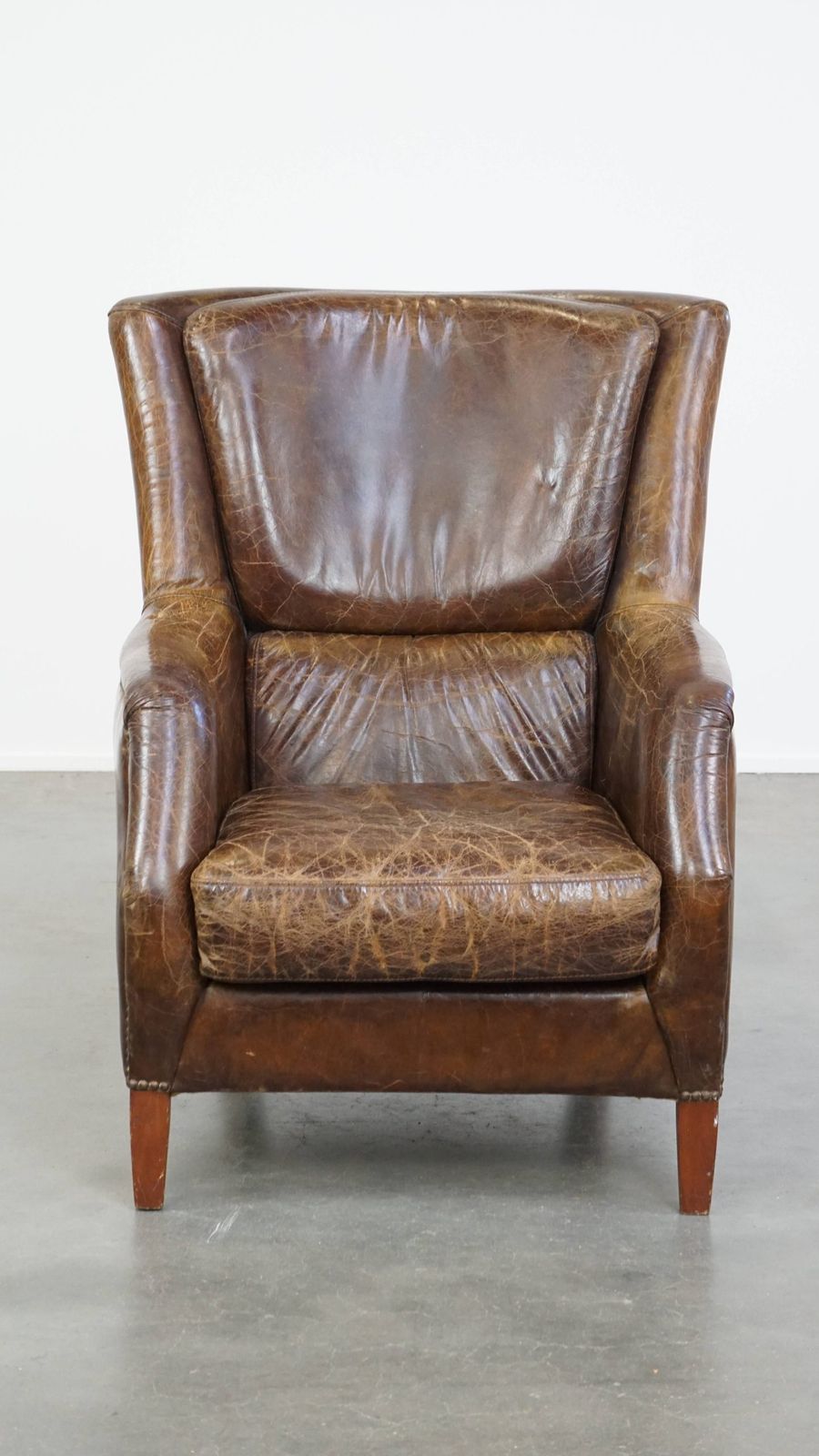 Stately And Comfortable Cowhide Armchair With A Timeless Design And A Beautiful Color Scheme photo furniture