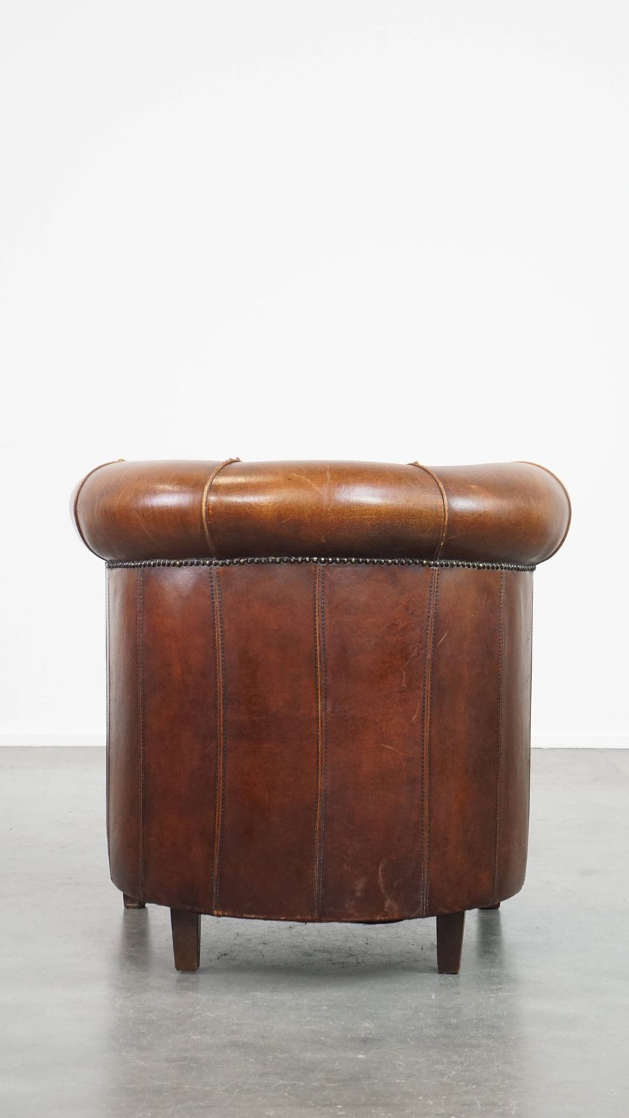 Sheepskin Club Chair In A Charming Cognac Colour And Finished With Piping On The Backrest photo Furniture