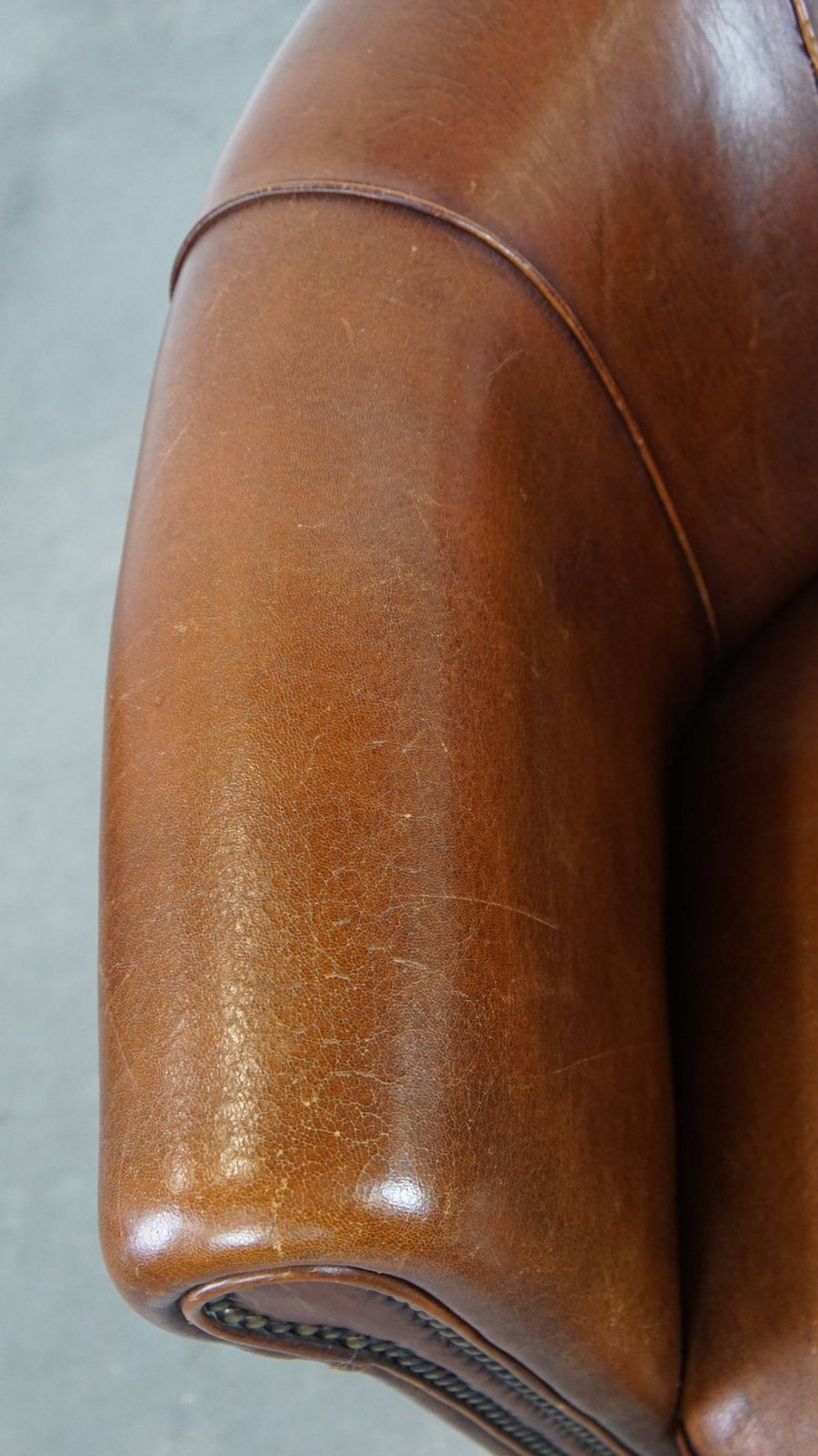 Sheepskin Club Chair In A Charming Cognac Colour And Finished With Piping On The Backrest photo buy