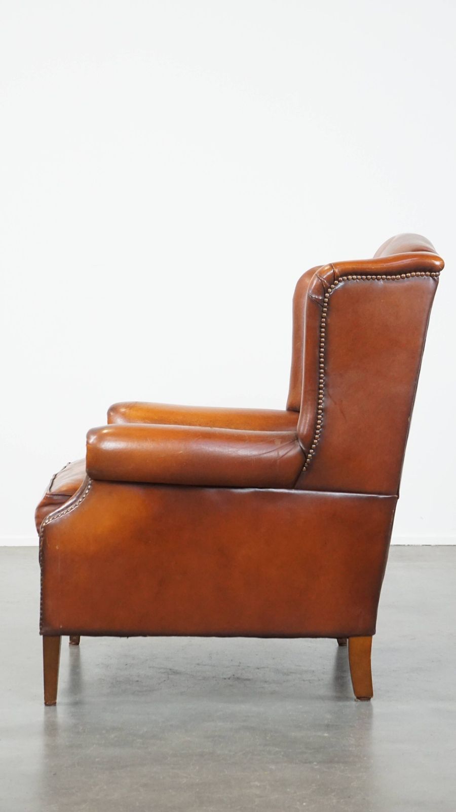 Comfortable Sheepskin Wing Chair With A Warm Color Scheme And A Beautiful Patina photo 799.4753999999999