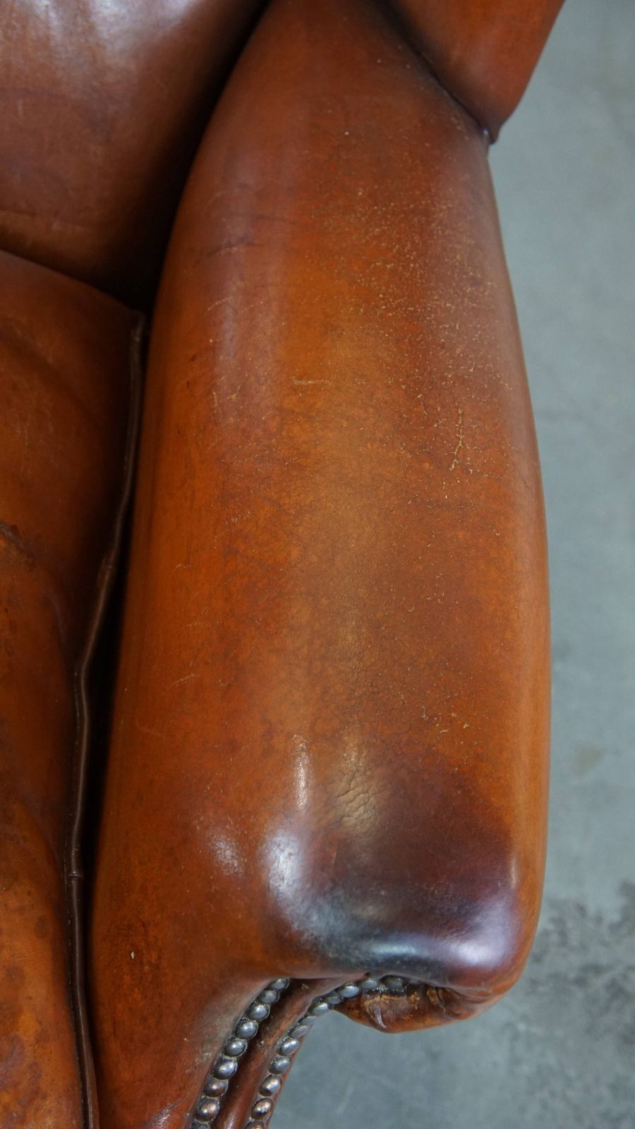 Comfortable Sheepskin Wing Chair With A Warm Color Scheme And A Beautiful Patina photo vintage
