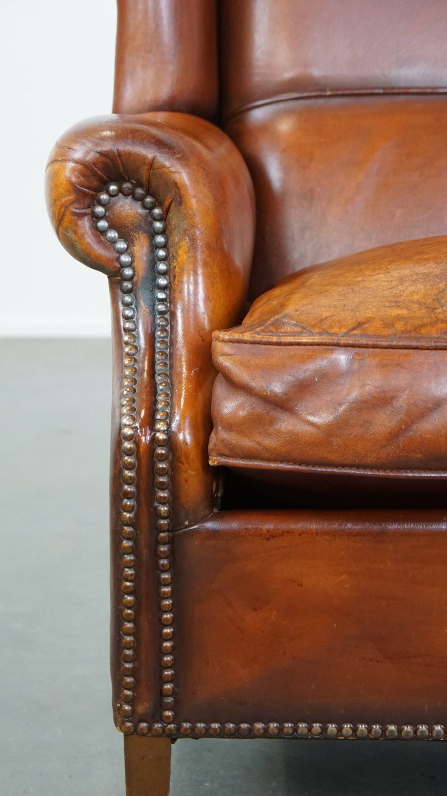photo for sale Comfortable Sheepskin Wing Chair With A Warm Color Scheme And A Beautiful Patina