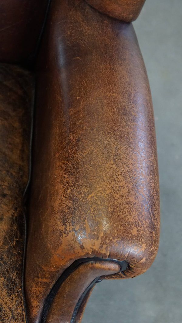 Characteristic And Comfortable Sheepskin Wing Chair With A Beautiful Patina photo vintage