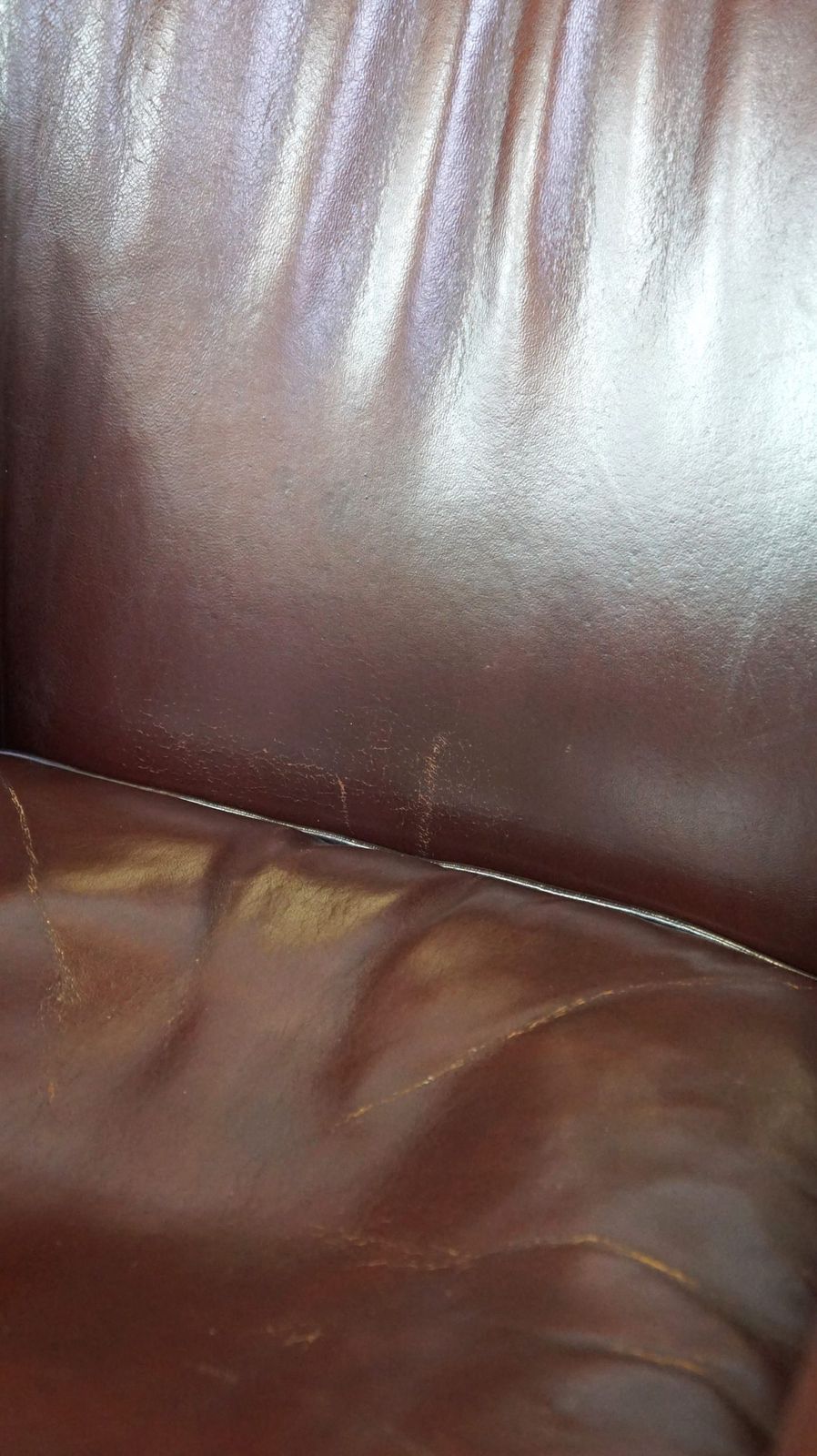 Furniture Nice Sheepskin Club Chair With A Beautiful Patina photo