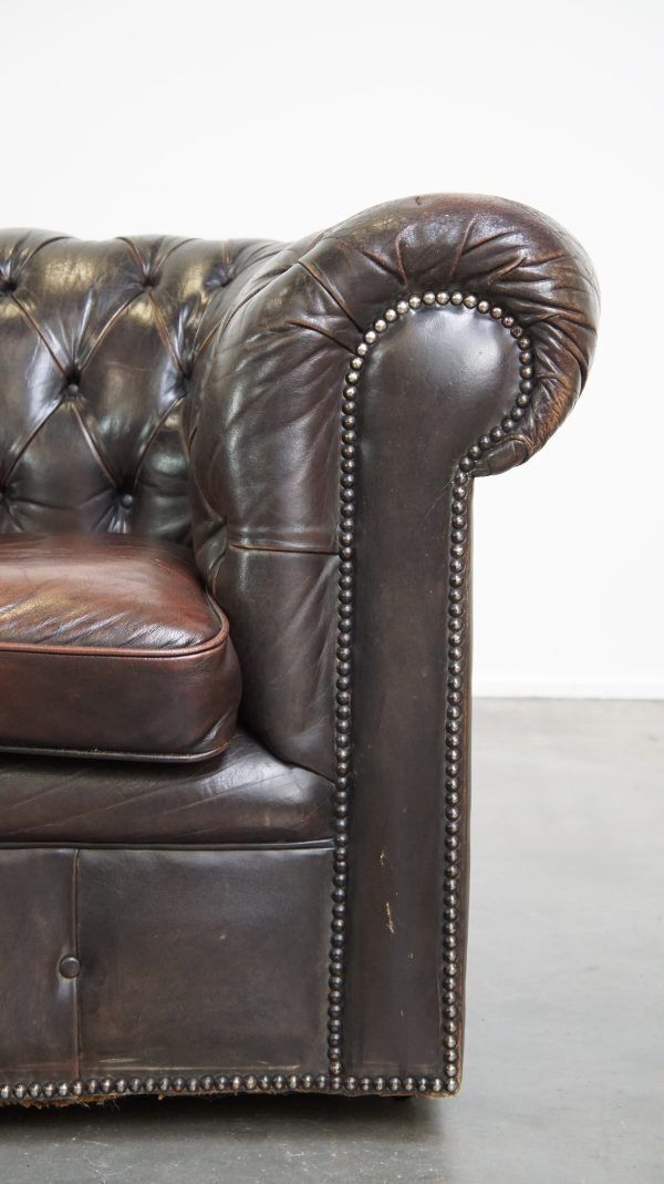 photo furniture Old Dark Brown 3 Seater Cowhide Chesterfield Sofa With Lots Of Character