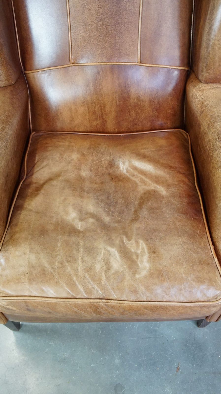 Graceful, Stylish, Timeless And Comfortable Wing Chair Made Of Cowhide In English Style photo vinterior