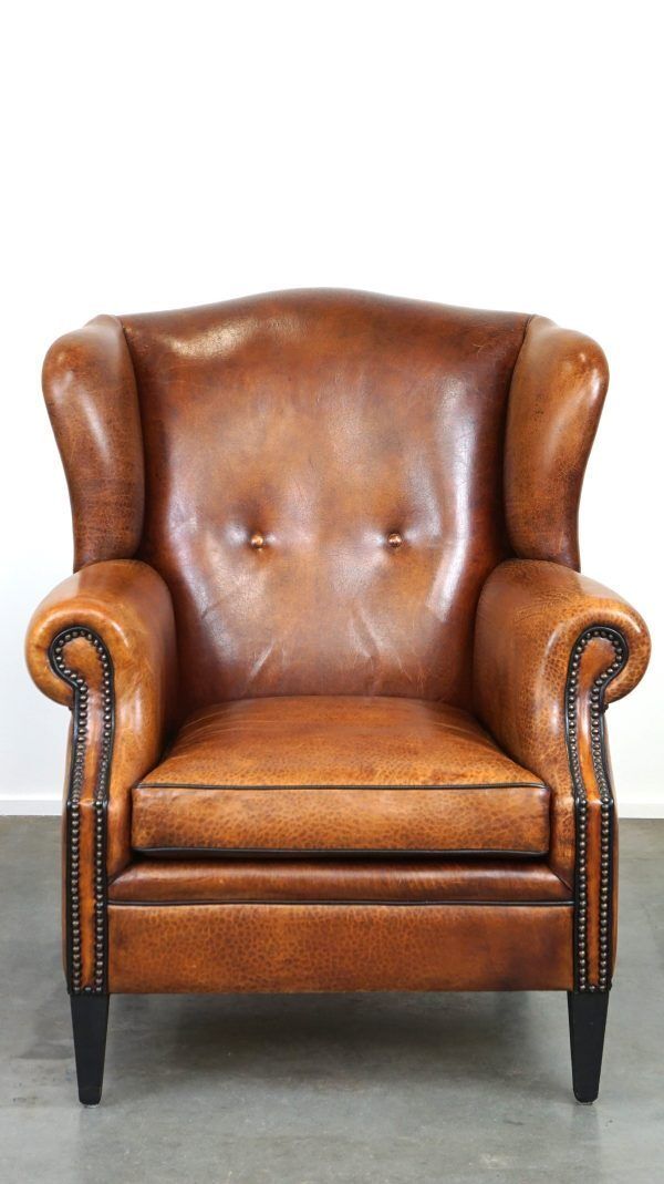 Beautiful Armchair Made Of Very Good Quality Sheepskin Finished With Nails And Black Piping photo Furniture