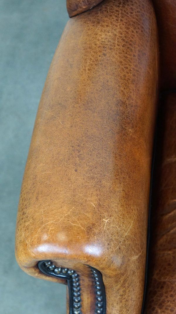 photo furniture Beautiful Armchair Made Of Very Good Quality Sheepskin Finished With Nails And Black Piping