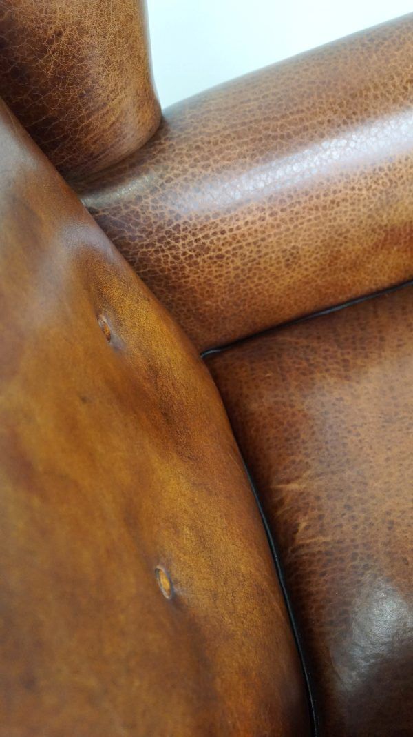Furniture Beautiful Armchair Made Of Very Good Quality Sheepskin Finished With Nails And Black Piping photo