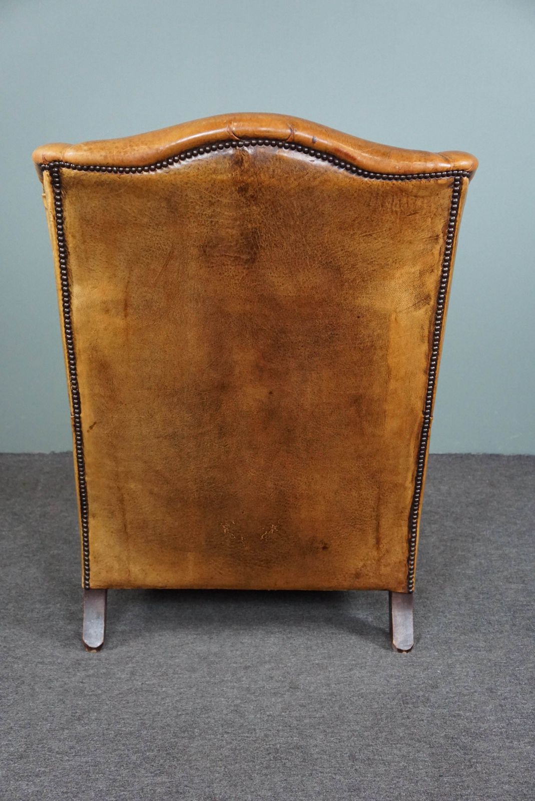 Expressive Cognac Colored Sheepskin Wing Chair photo Furniture